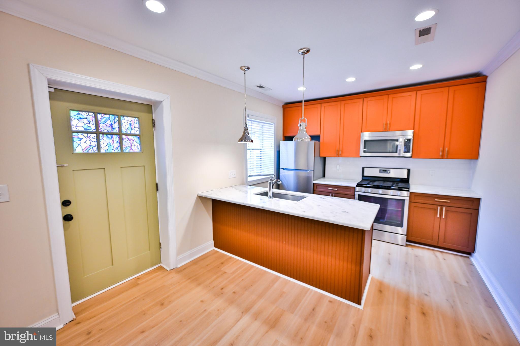 Welcome to 907 Stiles Street, nestled in the heart of Baltimore’s charming Little Italy. This beautifully updated 2 bedroom, 2 bathroom residence offers the perfect blend of comfort, style, and location.Step inside to an inviting open-concept living and kitchen area, ideal for both everyday living and entertaining. The modern kitchen features quartz countertops, stainless steel appliances, and ample cabinet space. New LVP flooring runs throughout the home, adding warmth and durability.The main level includes a spacious bedroom and a full hall bathroom, providing flexible living options. Upstairs, you’ll find a second generously sized bedroom complete with two closets and an additional full bathroom. In-unit laundry on the upper level adds everyday convenience. The home also includes one off-street parking space, a rare and valuable city perk.Enjoy city living at its finest, as the location alone speaks for itself. In additional to all Little Italy has to offer, this home is also just blocks from the Inner Harbor and Harbor East. You’ll have easy access to the renowned dining, shopping, and nightlife that all three neighborhoods offer. The historic neighborhood of Little Italy combines the perfect blend of convenient city living and the charming, vibrant attributes you can't help but love about Baltimore.