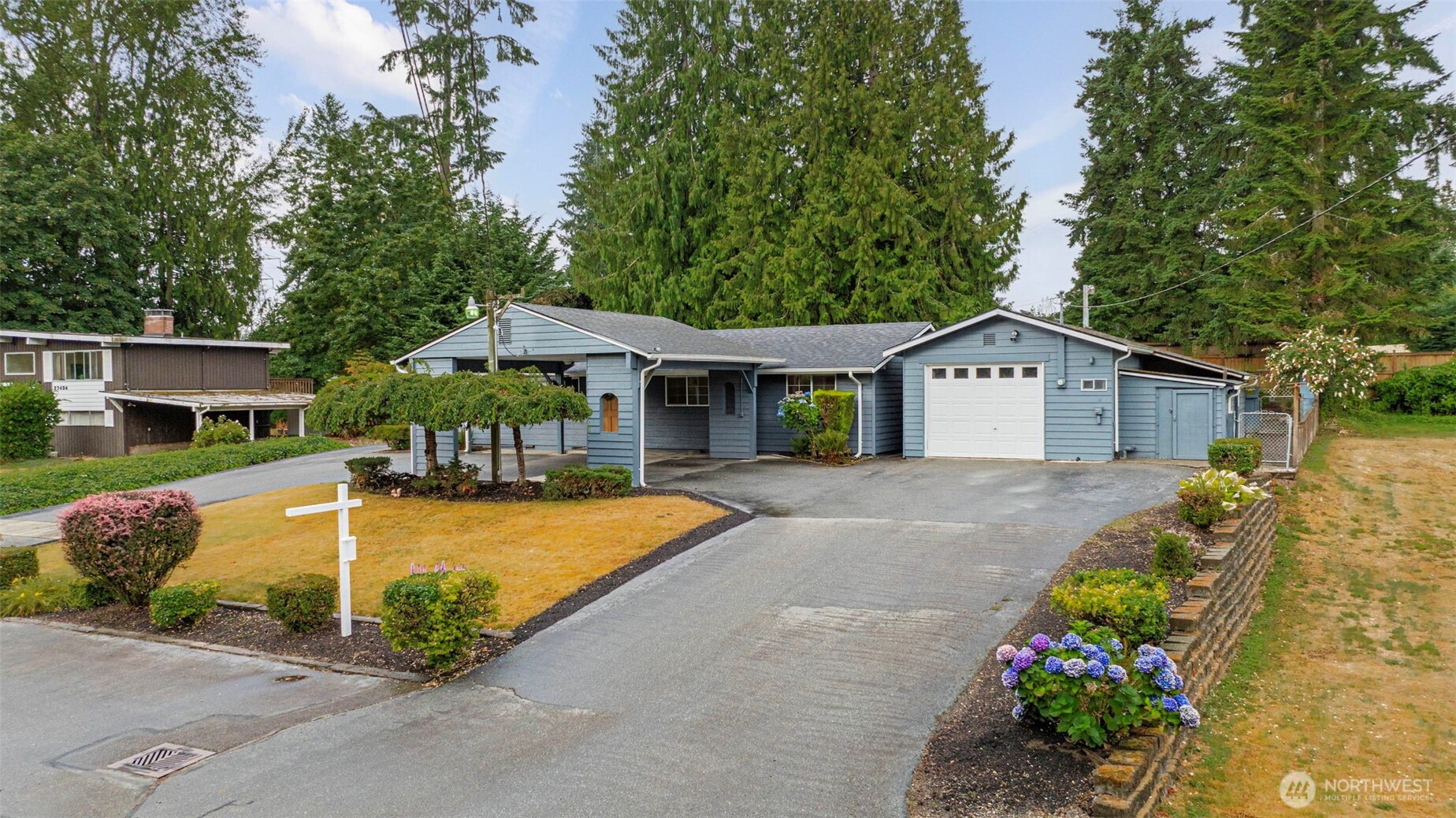 Sellers have lovingly maintained this home for 50 years, now it's your turn to make it your own! This home features 3 bedrooms, 2 bath, living room open to kitchen with eating space, fresh interior paint, and primary suite with attached bath.  Exterior features spacious 12,632 sq.ft. lot perfect for entertaining! Large deck w/ built-in table & playhouse, fully-fenced yard, mature landscaping, and sports court.  Detached garage, carport and multiple outbuildings providing tons of storage space, ample parking for boat/RV & NO HOA! New furnace, roof, gutters & exterior paint in 2020. Easy access to I5, close proximity to everything the desirable town of Brier has to offer - restaurant, parks & excellent schools!