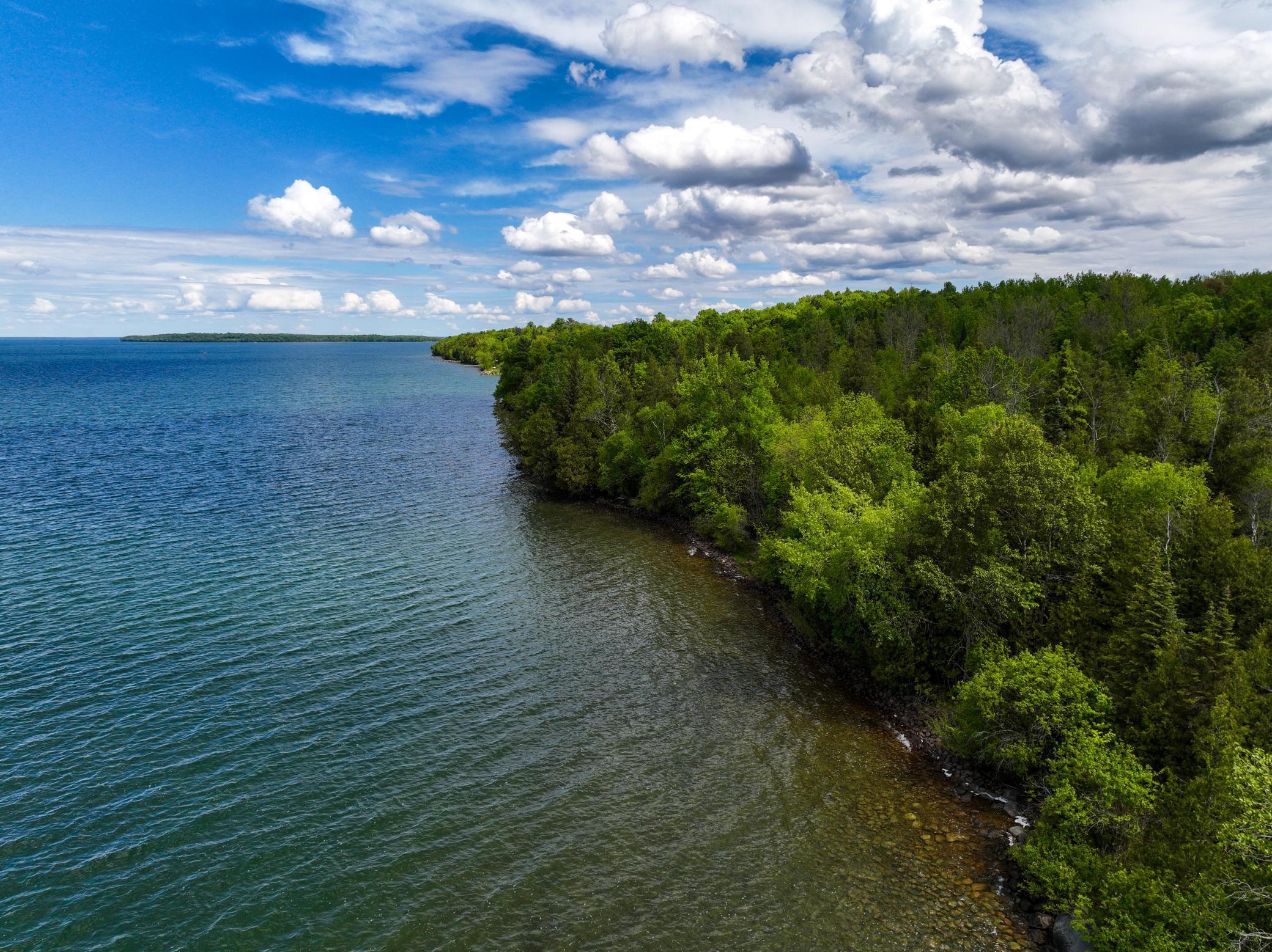 Tucked into the quiet side of Leech Lake near Longville and Brevik, this rare stretch of land is more than just a lake lot—it’s a chance to create something unforgettable. With over 1,000 feet of riprapped shoreline and 40+ acres of rolling hills, wetlands, and towering trees, the possibilities are wide open. Build your dream up-north getaway, design a luxury family compound, or explore the potential to split into multiple lakefront build sites. Trails have already been cut throughout the property, making it easy to tour the land and take in its west-facing lake views and expansive natural beauty. Bordering nearly 1,000 acres of Chippewa National Forest, this is a paradise for hikers, hunters, and anyone craving true seclusion with a lakefront backdrop. This kind of opportunity doesn’t come around often—schedule your tour to walk it for yourself. No drive-ups or drop-ins, please—tours by appointment only.