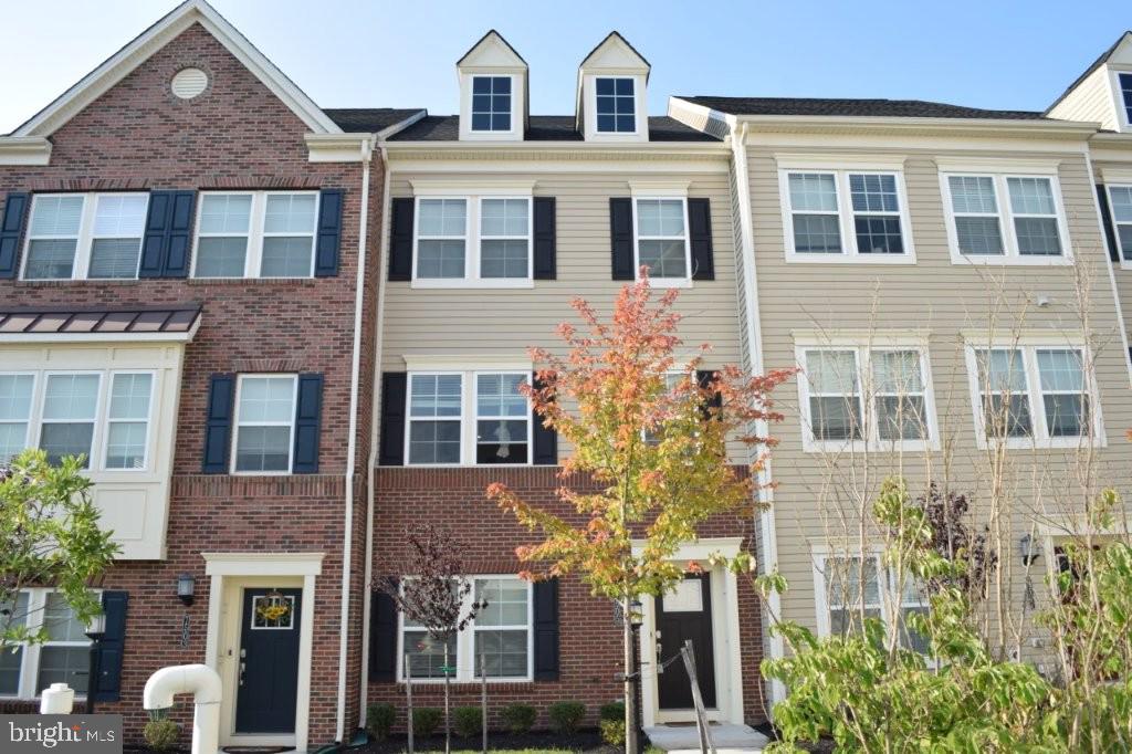 READY TO MOVE-IN! Built in 2021... this is a spacious townhome located in Oxford Square which offers many community amenities. The home is in close proximity to Fort Meade, NSA, Dorsey MARC train station, BWI Airport, and Arundel Mills and its Live Casino. There is also access to I-95, MD-295, Route 100, and Route 29. The property's prominent features a wide spacious deck patio located on the 2nd level and the lofty private deck patio with a loft bedroom on the 4th level.  Fully functional with 4 full bathrooms on 3 levels. The half bathroom is located on the 2nd level. Washer and dryer on 3rd level with master bedroom and 2 bedrooms. The kitchen has a wide range of appliances like the double ovens featuring a stainless-steel built-in double wall oven along with a spacious island.  One of the more niche features it boasts is an elegant, elevated tile above the master bathroom shower. There is also updated carpet and updated paint on the walls! Please schedule a private showing and see if this could be your future home!