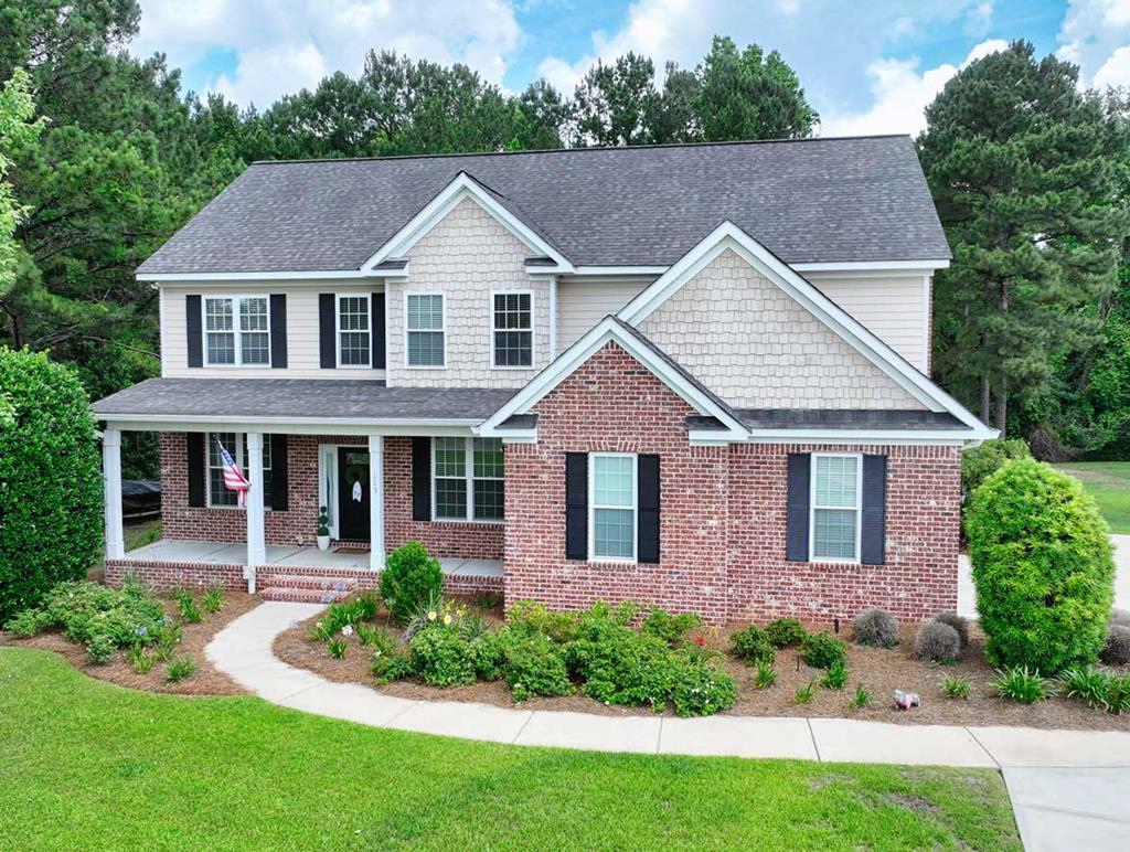 Welcome home to this beautiful custom brick 5-bedroom, 3-bath home located on a spacious .84 acre lot in the desirable Sweetbriar Lakes Subdivision. Thoughtful details and quality craftsmanship are showcased throughout, including elegant molding and beautiful arched doorways that add character and charm to every space. The foyer makes a warm first impression with its custom pine ceiling. The formal dining room features striking coffered ceilings, perfect for hosting gatherings and special occasions. An additional sitting room on the main level provides flexible space ideal for a home office or formal sitting area. The kitchen is designed for both function and connection, offering a four-seat bar for extra seating and opening seamlessly to the living room, making it easy to stay connected with family and guests. The living room is anchored by a stone gas fireplace and custom built-ins, creating a cozy yet refined atmosphere. Storage is plentiful throughout the home, adding to its everyday convenience, and one of the bedrooms can easily serve as a bonus room, offering even more versatility. The spacious primary suite is a true retreat, complete with an additional sitting area that works perfectly as a private TV space or secondary office, along with a large walk-in closet featuring custom shelving. Step outside to an outdoor living area that truly stands out, where a large screened-in porch overlooks a paver patio and a saltwater pool, providing an ideal setting for relaxing or entertaining year-round. Call today to schedule your private tour and experience all this home has to offer.