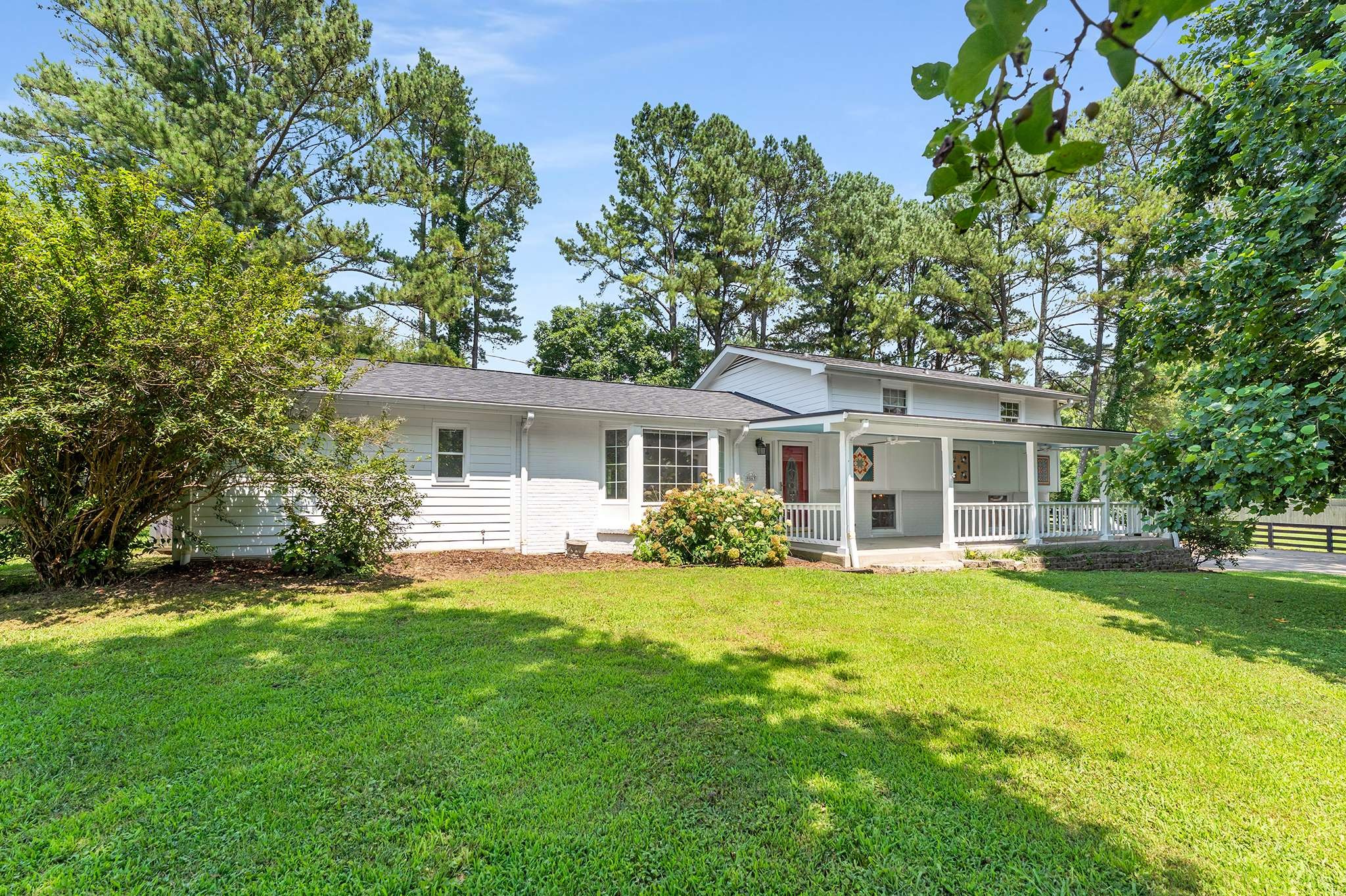 Perfect 5-acre horse farm conveniently located in Bellevue/Davidson County!! Renovated house features hardwood in dining, kitchen, and upstairs bedrooms and hallway, new flooring in Primary Suite and den, concrete flooring in rec room. All three bathrooms are updated. Roof is 2 years old. 5-ton HVAC unit is 2 years old and 2-ton unit is 7 years old. House features front and back covered porches and 422 square feet of deck. Property is fully fenced and cross-fenced with wire-lined plank fence.  Six stall horse stable with two rooms for tack and feed.  Additional storage in storage building/shed and two storage containers.  Level land with a gentle rise on the back left corner of the rectangular property.  Cabin with living room, bath, bedroom, and covered front porch built by Hilltop Structures.  Sheds, pond, chicken coop.  Tesla charging station.  Electronic gate opener.  Beautiful farm in a very convenient location!!