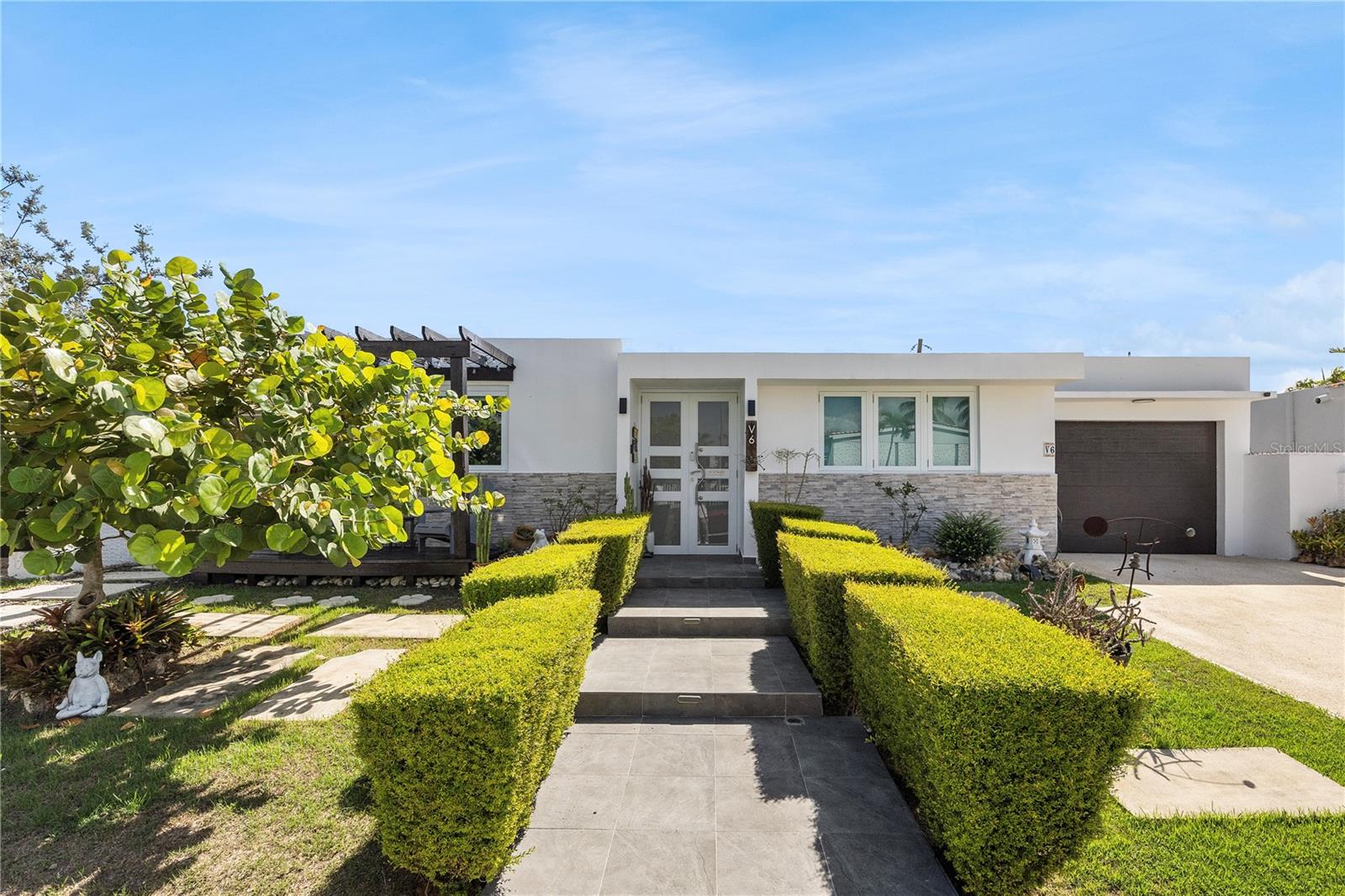 Located in the established coastal community of Dorado del Mar, this beautifully remodeled residence offers approximately 1,610 sq. ft. of living area with a modern and versatile layout. The property features three bedrooms with the flexibility to accommodate a fourth, three full bathrooms, spacious living and dining areas, a family room, and a modern kitchen. A thoughtfully configured portion of the residence features a private entrance, bedroom, full bathroom, and kitchenette, offering added privacy and potential for short-term rental income. Outdoors, a private fenced swimming pool and terrace create an inviting setting for entertaining and enjoying the Caribbean lifestyle. Dorado del Mar offers convenient access to the beach and places the property within a community that is home to Dorado Academy and the Dorado del Mar Golf Club, while remaining close to restaurants, shopping, and everyday conveniences throughout Dorado. HOA: $90/month. CRIM: $1,649/year.