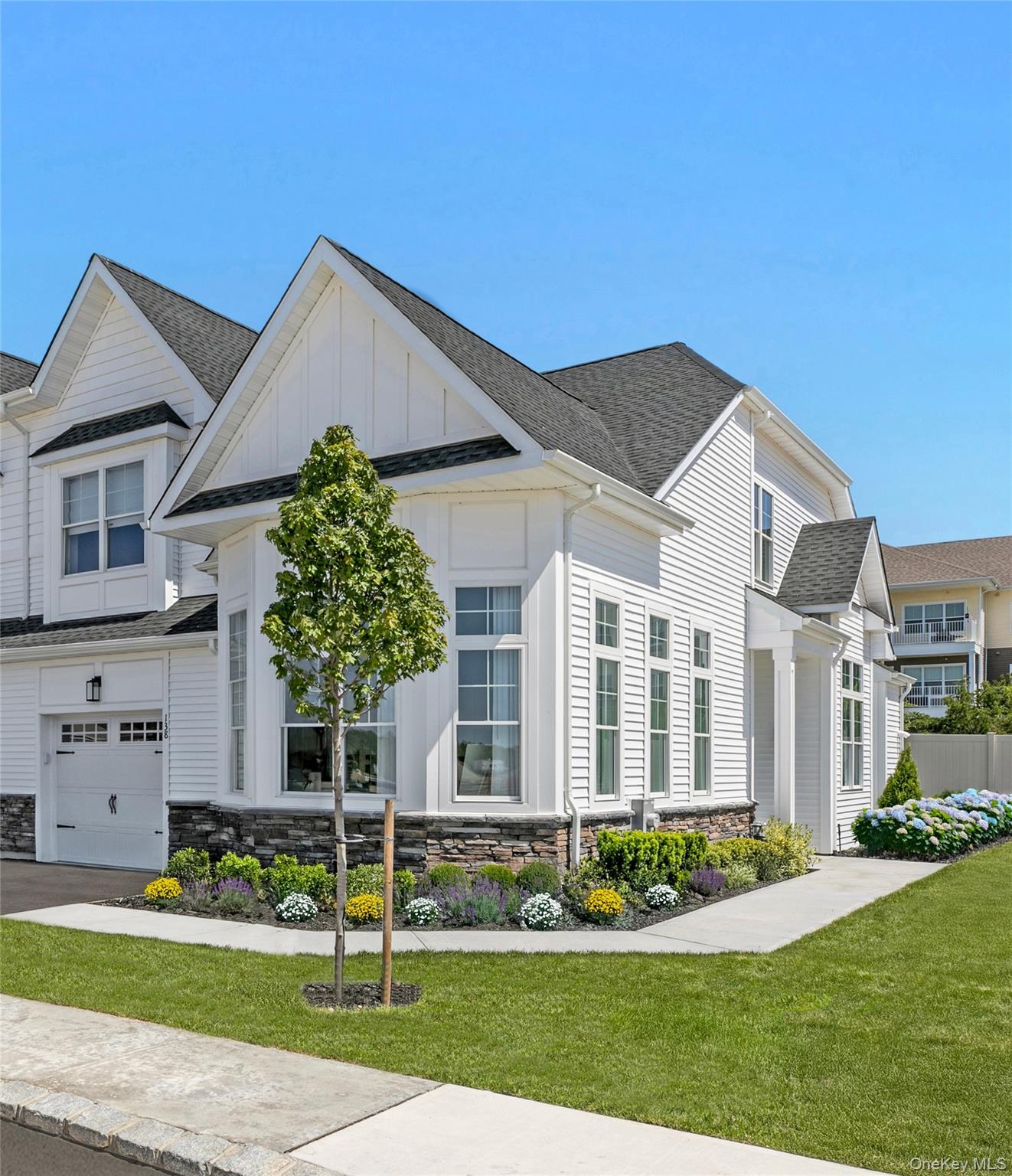 Welcome to 128 Juniper Lane, a beautifully crafted Birch model townhouse, currently under construction in the newly developed gated community of Country Pointe Preserve. This thoughtfully designed home will combine modern comfort with timeless sophistication.Upon completion, the home will feature a grand two-story foyer that opens to a bright dining area and a spacious living room with vaulted ceilings, a cozy fireplace, and access to a private patio—perfect for relaxing or entertaining. The chef’s kitchen is designed to be flooded with natural light from expansive windows and will include a sunlit breakfast area, ideal for morning coffee or casual meals.The first-floor primary suite is planned as a luxurious retreat with a spa-like en-suite bath and a spacious closet. A conveniently located laundry room and powder room will complete the main level. Upstairs, a versatile loft will overlook the foyer and dining area, creating an airy, open feel. The second floor will also include a generously sized bedroom with a large closet, a full bath, and a flexible den—perfect for a home office or guest space.Country Pointe Preserve is a prestigious gated condominium community offering an unmatched lifestyle experience. Residents will enjoy a state-of-the-art clubhouse featuring an outdoor pool, indoor pickleball courts, fitness center, golf simulator, game room, lounge, cardroom, and elegant clubroom—all designed to foster connection, wellness, and leisure.Experience the perfect blend of luxury, comfort, and convenience at 128 Juniper Lane in Country Pointe Preserve—where every detail is designed for exceptional living.Photos are of a similar home.Home is currently under construction. Features and finishes may vary.Sale may be subject to terms & conditions of an offering plan.Purchaser will receive offering plan for verification of monthly maintenance charges and financial information at time of purchase (actual fees may vary).