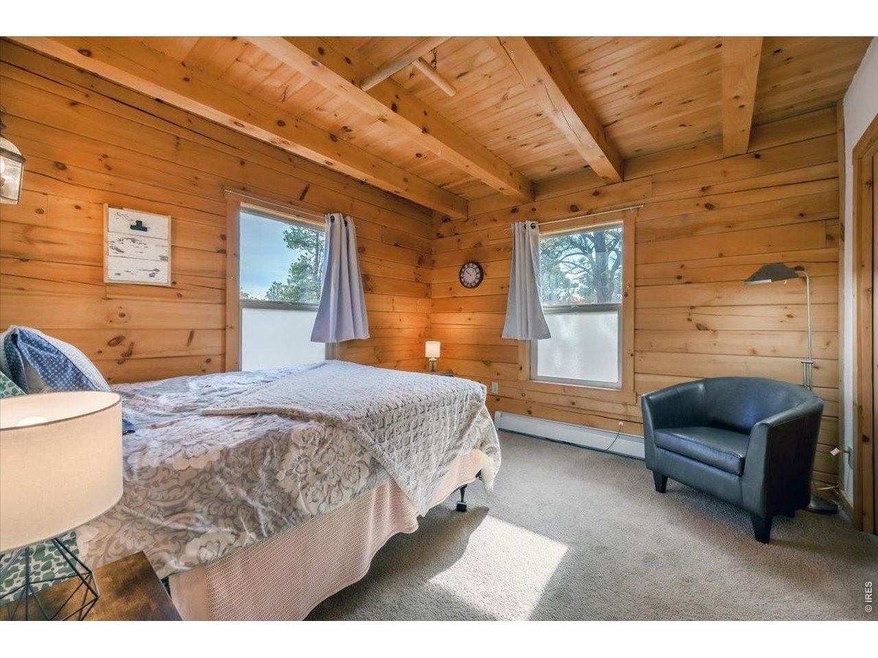 SPECTACULAR VIEWS from this log home In Glacier View Meadows! Just 30 minutes from Fort Collins and only a couple of minutes off of paved West CR 74 E. This year-round home, located at the end of a cul-de-sac, offers the privacy and vistas that we all look for in mountain living. Exposed beams, open loft, and pine finishes add to that charm. Features include a private well with 1000 gal cistern, septic system with leach field, hot water heat, wood-burning stove, and shed. This hard-working cabin has multiple decks for outdoor access and lots of parking for guests. It's completely furnished, including kitchen wares and bath. Notice the low HOA dues. Front of home abuts Glacier View Meadows open space. This home checks all the boxes!