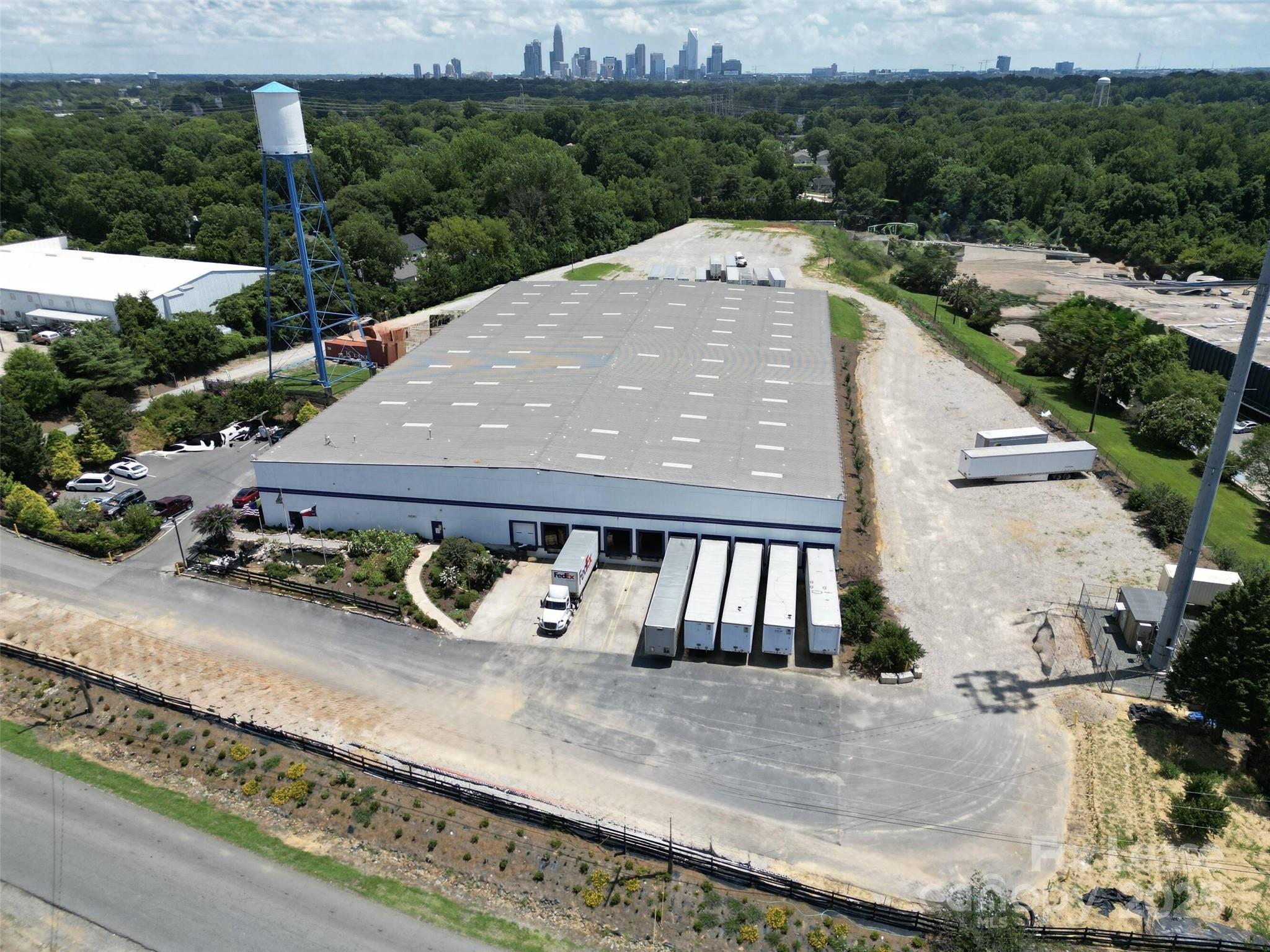 Discover a premier industrial and flex warehouse opportunity in the heart of the Greater Charlotte industrial market. This impressive 63,000± square foot warehouse is strategically located on Dupree Street, just off Interstate 85, providing excellent highway visibility and direct access to major transportation routes connecting Charlotte, Concord, Gastonia, and Fort Mill, SC. With its rare I-2 Heavy Industrial zoning, this property offers exceptional flexibility for a wide range of manufacturing, logistics, distribution, and storage uses, making it a top choice for industrial tenants, owner-users, or investors seeking a high-performing asset in the Charlotte metro area.The warehouse is designed for operational efficiency and versatility, featuring a front-load layout with 10 dock-high doors, two pit levelers, and one drive-in door that streamline loading and unloading operations. Ample parking and a spacious truck court allow for smooth traffic flow and easy maneuverability for delivery and freight vehicles. The steel frame construction and attractive stucco front façade combine durability with modern curb appeal, while energy-efficient LED lighting ensures enhanced visibility and lower operating costs throughout the facility.Inside, the property includes approximately 5,945 square feet of office space, offering conference rooms, private offices, a break room, and storage areas—ideal for administrative, management, or dispatch operations. The building’s 3-phase power, along with a 400V/480V transformer, provides ample electrical capacity for heavy equipment and manufacturing users. Additionally, a dry fire suppression system is installed throughout the warehouse, meeting safety requirements for a variety of industrial users.The property also includes a secure, fenced outdoor storage yard spanning approximately [insert acreage] acres, ideal for industrial outdoor storage (IOS) of trailers, containers, or equipment. This added functionality makes the site highly desirable for logistics and distribution companies seeking both indoor and outdoor operational space. Located just minutes from Charlotte Douglas International Airport, major freight terminals, and interstate access points, this warehouse provides unmatched logistical advantages within one of the fastest-growing industrial markets in the Southeast.With its prime location, I-2 zoning, heavy power, and modern upgrades, this Charlotte industrial warehouse stands out as a rare opportunity for companies looking to expand their operations or investors seeking to capitalize on Charlotte’s booming industrial corridor.·  Prime Charlotte Industrial Location: Strategically positioned near I-85, I-77, and I-485, this industrial flex warehouse for lease in Charlotte, NC offers unbeatable regional access to Uptown Charlotte, Concord, Gastonia, and Fort Mill SC ideal for distribution, logistics, and light manufacturing users.·  Flexible Warehouse-Office Design: perfect for service contractors, e-commerce fulfillment, or regional headquarters.·  Modern Building Systems & Upgrades: Includes LED lighting, climate-controlled office areas, and energy-efficient systems for reduced operating costs turnkey ready for industrial or flex tenants looking for move-in-ready warehouse.·  Ample Loading & Parking: Features multiple dock-high and drive-in doors, spacious truck courts, and on-site employee and visitor parking, supporting seamless operations for delivery vehicles, fleet trucks, and trailers.·  Zoning & Outdoor Storage Capabilities: Zoned I-2 Heavy Industrial, allowing for a wide range of industrial, distribution, or storage uses, including secure fenced outdoor storage yards and equipment parking options.·  High-Growth Charlotte Industrial Corridor:  Charlotte industrial market, one of the fastest-growing logistics hubs in the Southeast, with proximity to Charlotte Douglas International Airport, Amazon distribution centers, and  freight carriers