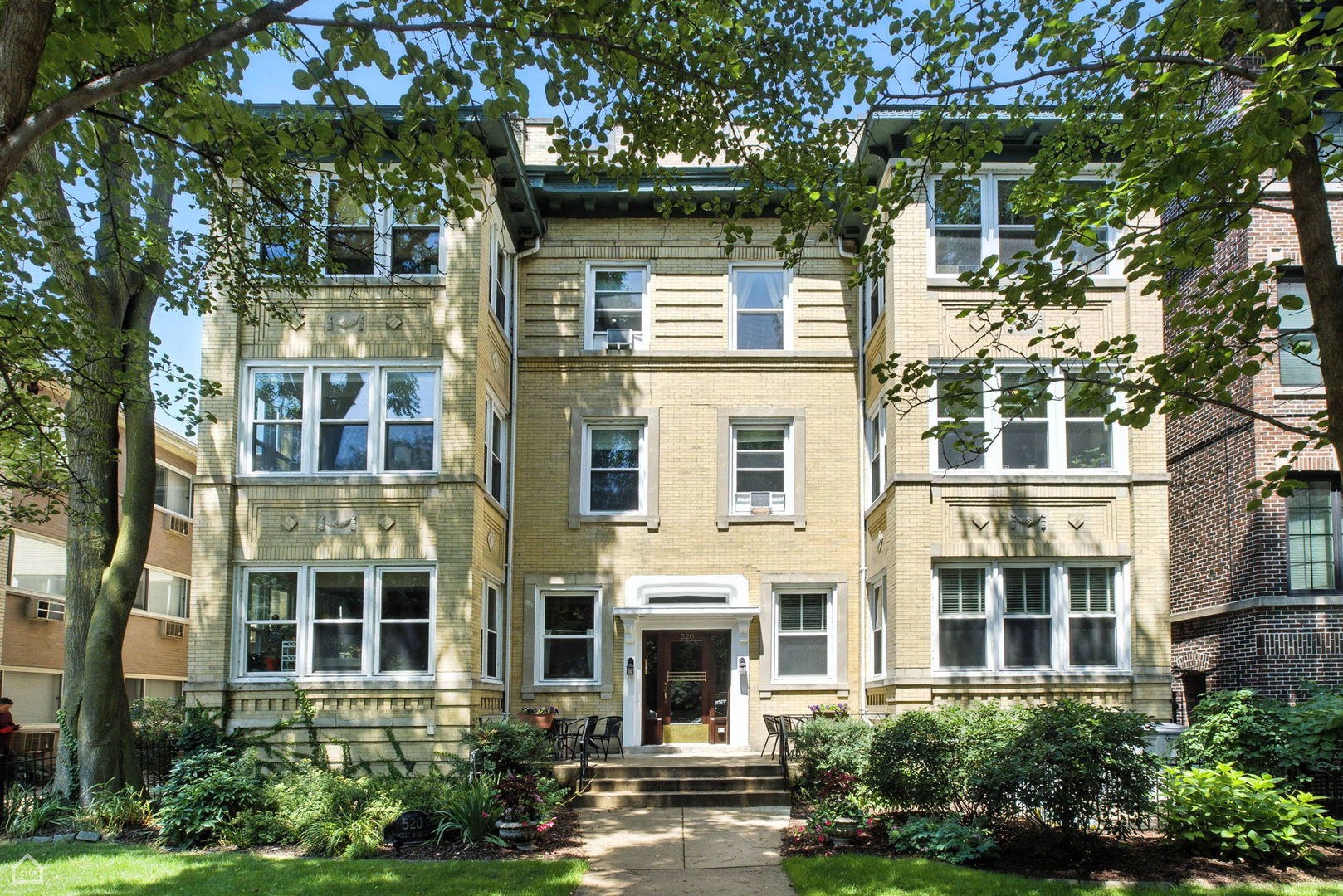 Just a short walk to the lake, this stunning oversized 2 bedroom gem in East Lakeview blends thoughtful modern updates with vintage character. Originally a 3 bedroom, this pristine condo boasts newer real hardwood flooring throughout, recently installed central air, a fully remodeled chef's kitchen, two modern baths, a large separate dining room and open, airy family room/office/flex space. Spacious living room offers plenty of flexibility for entertaining, featuring a bright sun room with three exposures. Gut-remodeled, expanded kitchen features plenty of custom two-toned cabinetry with tall uppers, under-cab lighting, cove molding, stylish backsplash, gleaming stainless steel appliances and an abundance of quartz counter space to work. Third bedroom has been creatively opened into a sunny, inviting flex space. Second bathroom gut renovated with timeless subway and patterned hex tiles. In-unit laundry! Perfect blend of cozy radiant heat and comfortable central air (added in 2019). Amazing storage throughout the unit, with an additional oversized dedicated storage unit in the basement. Beautifully landscaped common yard and patio in the back -- a rare, serene urban sanctuary w/ plenty of space to play, grill and relax. Pets are welcome! Well-managed building has been meticulously maintained over the years, and is nicely set back on the lot, with an expansive, gated front yard. Amazing location: steps to Belmont Harbor/Lake Michigan, an endless amount of terrific restaurants and entertainment venues throughout Lakeview, several excellent grocery options, Wrigley Field, Nettlehorst Elementary, express buses to downtown, and much more. Be sure to explore the 3D Matterport walkthrough via the Virtual Tour link!