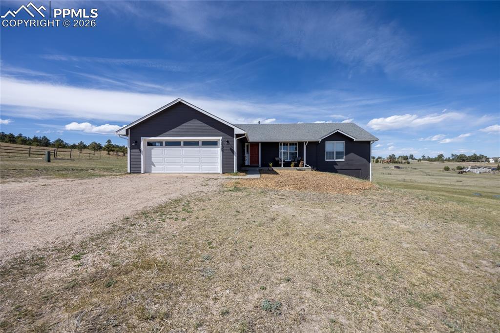 Charming 4 Bed 3 Bath Ranch on 5 Acres with Horse Barn in the Rivers Divide Community. Welcome to this beautifully renovated ranch-style home, offering the perfect blend of modern updates and peaceful country living. Nestled in a serene rural neighborhood, this property sits on a generous 5-acre lot.The main level boasts an open floor plan with crown moldings and newly refinished hardwood floors throughout. The living room features vaulted ceilings, built-ins and a fireplace. Adjoining the living room is an eat-in dining area which walks out to the deck. The modern kitchen features updated shaker cabinetry, stainless steel Kitchenaid appliances, farm style sink, open shelving and a large island with butcher block counters. The primary suite features custom paneling, walk in closet and primary bathroom with a claw foot bathtub. There are two additional main level bedrooms with walk in closets. The main bathroom has Marble counter tops. Enjoy main level laundry hook ups. There is a two car garage.  The fully finished basement features new Luxury Vinyl Plank floorings and includes a second primary suite with ensuite bathroom, recreation room, family room and laundry room. The basement suite features French doors and spa-like bathroom with dual vanity, walk-in shower with bench and jacuzzi bathtub. Washer and dryer included in the laundry room. Step outside and enjoy the fully fenced property which includes a deck, porch, patios and a 24’x24’ 2 stall barn with 12’ sliding door, service door, hay storage area, water and electric. Whether you’re seeking a quiet country escape or a functional homestead, this move-in ready ranch home checks every box. Don’t miss your opportunity to own a piece of serene rural paradise.This home features so many NEW upgrades - NEW hardwood and LVP floors throughout, NEW trim, NEW two panel doors, NEW fixtures, NEW interior  paint, Furnace (2021),  Radon system (2021), Remodeled kitchen (2022), Updated bathroom (2022).