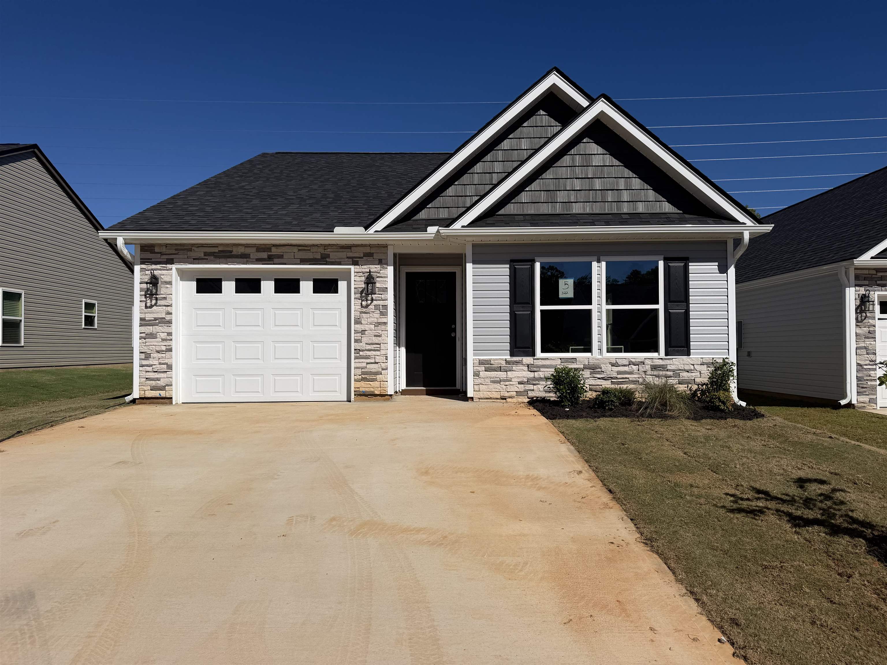 Welcome to the beautifully designed Wrenley Plan, located in the desirable Stone’s Throw community in Inman, SC. This thoughtfully crafted 2-bedroom, 2.5-bath home offers 1,192 square feet of efficient, low-maintenance living with modern finishes throughout. The open-concept main level features a spacious living area that flows seamlessly into the kitchen and dining space. The kitchen is equipped with stylish cabinetry, granite countertops, stainless steel appliances, and a convenient island for additional prep and seating space. A powder room on the main floor adds functionality for guests. Two generously sized bedrooms, each with its own private full bathroom—ideal for roommates, guests, or added privacy. The owner’s suite includes a walk-in closet.Located in the growing Stone’s Throw community, you’ll enjoy easy access to shopping, dining, schools, and major highways while still experiencing the charm of Inman living. Low-maintenance design, modern style, and prime location—Schedule your showing today!