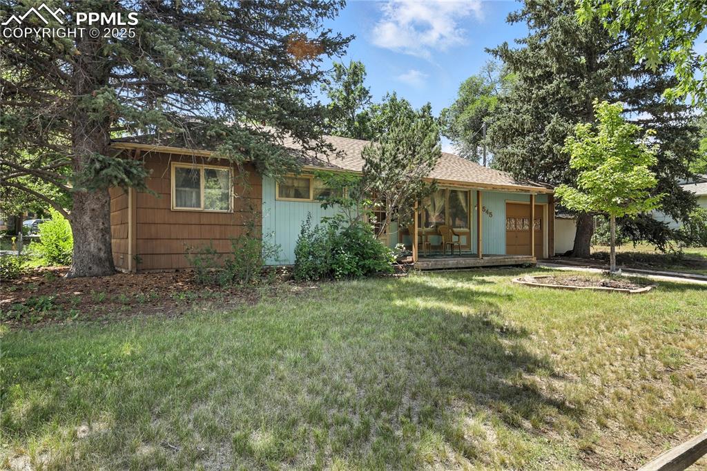 WELCOME TO THIS WELL-LOVED 3-BEDROOM, 1-BATH RANCHER NESTLED ON A SPACIOUS HALF-ACRE CORNER LOT IN THE DESIRABLE SMARRTS NEIGHBORHOOD WITH NO HOA RESTRICTIONS. OFFERING A 1-CAR ATTACHED GARAGE AND LAUNDRY CONVENIENTLY LOCATED ON THE MAIN LEVEL OFF THE GARAGE, IT PROVIDES COMFORTABLE LIVING IN A PRIME CENTRALIZED COLORADO SPRINGS LOCATION. INSIDE, YOU’LL FIND THE KITCHEN WITH A BUILT IN DESK. THE SPACIOUS OPEN LIVING AND DINING ROOM COMBO WALKS OUT TO A RECENTLY RENOVATED CONCRETE COVERED BACK PATIO. THERE IS ALSO A COVERED FRONT WOODEN DECK. HOME SOLD AS-IS AND OFFERS SO MUCH POTENTIAL FOR YOU TO BRING YOUR PERSONAL TOUCH AND CREATE YOUR DREAM SPACE. JUST MINUTES FROM PARKS, SCHOOLS, SHOPPING, AND RESTAURANTS, IT OFFERS THE CONVENIENCE OF CITY LIVING WITH THE SPACE AND FREEDOM YOU’VE BEEN LOOKING FOR.