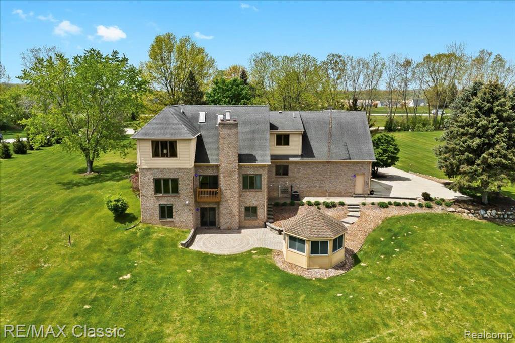 This stunning custom-built home offers 4 spacious bedrooms and 4 full bathrooms, perfectly nestled on 5 acres plus a 14-acre private park. Bright and inviting great room features a beautiful gas fireplace ideal for those cold nights. The huge primary bedroom is a true sanctuary complete with a large en-suite bathroom featuring heated floors, & jetted tub. Gourmet kitchen with beautiful granite counters, large island, lots of cupboards and newer appliances extends to the dining room. Two large linen closets and lots of closets designed by California Closets. Full finished walkout basement is a true retreat great for entertaining. Complete large wet bar, workout room, office or possible 5th bedroom. Basement is so bright no need to turn on lights during the day. Ample space for gatherings and extends to a brick paver patio and gazebo. Oversized 3-car garage with a sleek epoxy floor. Newer Anderson windows throughout ensuring energy efficiency. Whole-house generator and leaf gutters adds peace of mind. Furnace and A/C less than 4 years old. Hot water heater and sump pump 2024. So many features on this home. The yard has lots of space to plant a garden/flowers, play games with your children, or practice your golf swing. Lots of Anderson windows in each room to enjoy the wonderful wild life that you can spend hours sitting inside or outside and enjoying the view. Sellers will consider all reasonable offers.