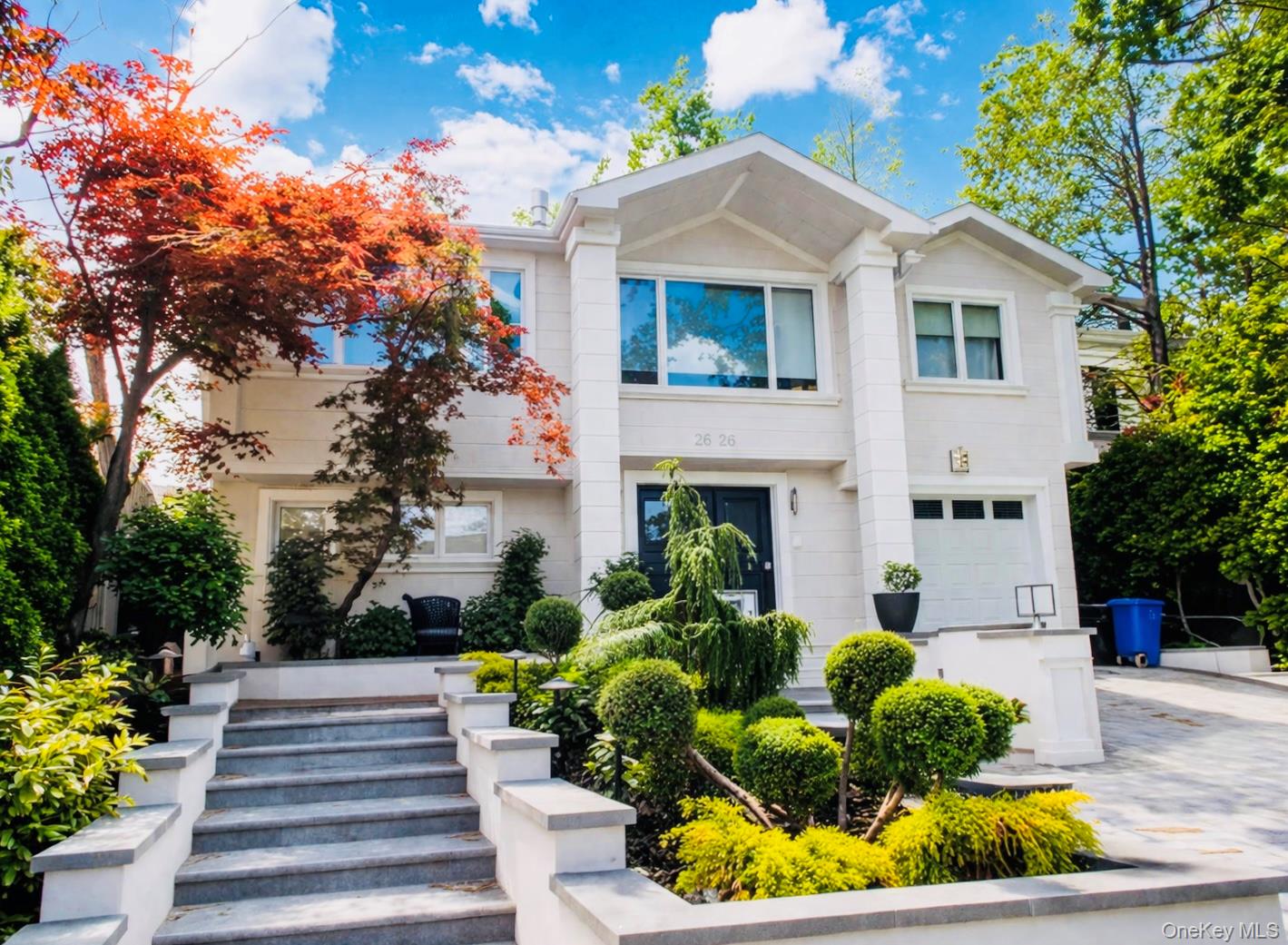 Stunning contemporary single-family home located in the highly desirable Bayside (Bay Terrace area). Situated on a 52'x119' lot (approx. 6,188 SF) with approximately 3,528 SF of interior living space, this beautifully renovated residence offers luxury, space, and convenience.The home features 4 bedrooms and 3 full bathrooms, highlighted by an open-concept layout with a spacious dining area and a designer island kitchen equipped with high-end materials and appliances. The kitchen and entertainment area include a custom wet bar, wine cooler, dishwasher, and refrigerator, and open to a covered brick patio—perfect for indoor-outdoor living.The second-floor primary suite offers skylights, ample closet space, and a spa-quality bathroom, with access to a private tiled balcony. Additional highlights include three generously sized bedrooms, a comfortable sitting area with fireplace, laundry area, and a kitchenette for added convenience.Conveniently located near Bay Terrace Shopping Center, with easy access to supermarkets, restaurants, and daily amenities. Close to QM2 Bus, QM20 Bus, Q13 Bus, Q28 Bus, and Q16 Bus, as well as the LIRR for a convenient commute to Manhattan and Flushing.Enjoy proximity to Fort Totten Park and Bayside Marina, offering waterfront views, outdoor recreation, and a relaxed lifestyle.A rare opportunity to own a move-in ready luxury home in one of Bayside’s most sought-after locations.