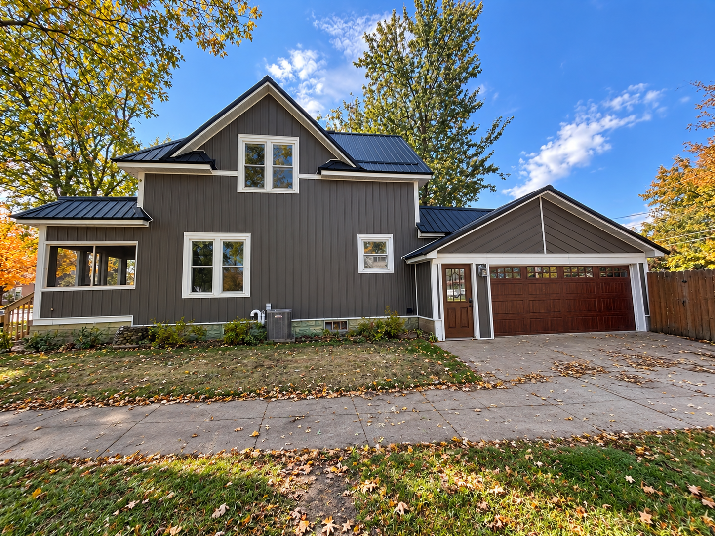 A great start with many of the major updates already completed for you!  This 4-bedroom, 2 bath home features a BRAND-NEW STEEL ROOF AND TEXTURED STEEL SIDING INSTALLED IN 2026, along with an NEW HVAC SYSTEM IN 2022, including the furnace and central air.  Inside you'll appreciate the spacious feel of the 9-foot ceilings and over 1800 square feet of living space.  Situated on a corner lot with a fenced backyard and attached 2-car garage, this home offers plenty of potential to make it your own.  The location is hard to beat-just a short walk from Main Street shopping, dining, and entertainment, and also just a couple blocks from the elementary school.  With several of the big-ticket items already taken care of, this home is ready for its next owner to add their personal touches.  Call for your showing today!