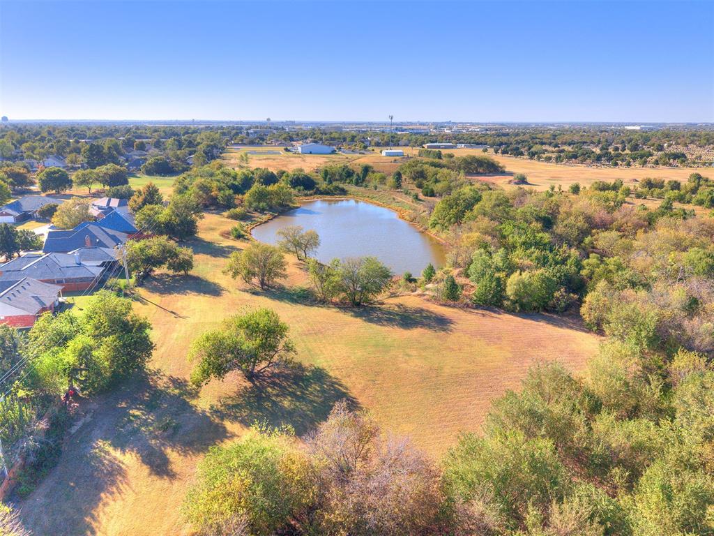 Currently zoned commercial.  Would make a pretty small subdivision, a small office building or mini storage.  Please contact the city to inquire.  Lots of great pictures and drone to view the land.  Small pond takes up 1.5-2 acres.  Very nice addition.  East side boarders Sutton Wilderness and west side boarders Church of the Nazarene.