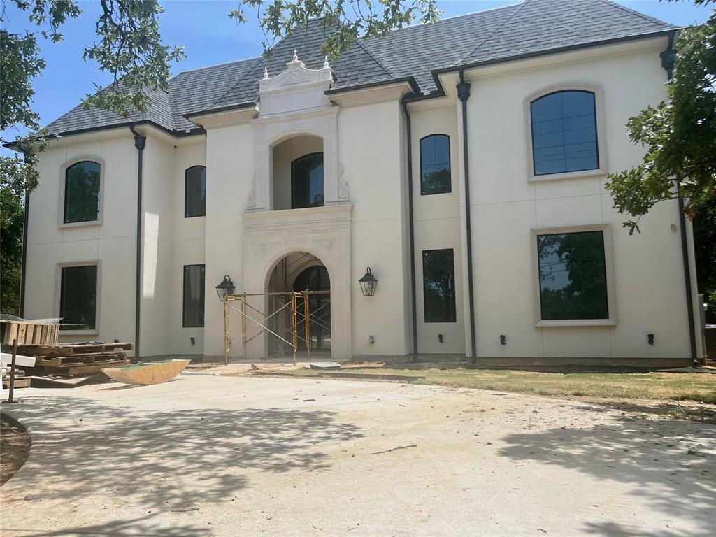 Scheduled for May 2025 completion.  Luxury living at its finest in this french inspired 6,988 square foot home that boasts three stories of exquisite detail from top to bottom as soon as you walk through the door! A double rounded staircase with soaring 24 foot ceiling greets you as soon as you enter this beautiful home. From a 27 foot tall fireplace in the living room to your private patio off the primary suite, this home merges both warmth and grandness in the perfect way. Marble countertops, luxury lighting and designer appliances, a sprawling kitchen with separate baker pantry that is perfect for entertaining. The second floor splits at the top of the balcony to separate a guest suite and the most perfect wing for children, featuring two bedrooms and two bathrooms with a two story game room or play room that is a perfect family oasis. The third floor boasts a 1200 square foot space perfect for a another flex room or media room for movie magic. This home sits on .73 acres with no HOA. This home is currently under construction. Please contact listing broker for questions or to schedule a tour.