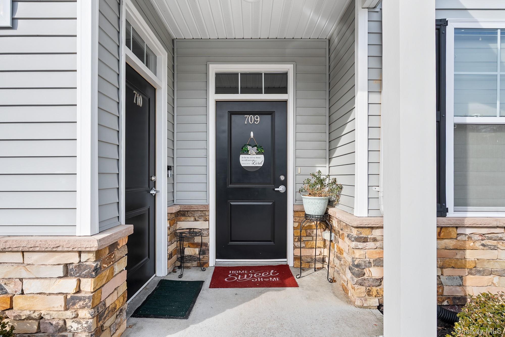 Enjoy life in the vibrant Breton Hills 55+ Community in Glen Cove. This desirable ground-floor end unit offers easy, single-level living with an open-concept layout ideal for both everyday comfort and entertaining. The spacious living room flows seamlessly into the dining area and modern kitchen, which features ample cabinetry, generous counter space, and stainless-style appliances.The home includes two large bedrooms, each with closets, and two beautifully updated bathrooms. Additional highlights include abundant storage throughout and a washer and dryer conveniently located inside the unit.Breton Hills offers an active and welcoming lifestyle with beautifully maintained grounds and a resident clubhouse featuring an interior fireplace, kitchen, and fitness area. Outdoors, residents enjoy a patio with gas barbecues, perfect for gatherings and seasonal events. The community hosts social activities such as card games and dinners, fostering a friendly and engaging atmosphere. Ample parking and designated garbage areas for residents add to everyday convenience.This move-in-ready condo is located within a secure, gated community and offers close proximity to all that Glen Cove and the North Shore have to offer. Enjoy nearby Morgan Park, Pryibil Beach, Crescent Beach, Glen Cove Golf Course, and miles of scenic waterfront. Conveniently located near shopping, dining, and major highways, this home presents an exceptional opportunity for comfortable, low-maintenance living in a sought-after 55+ community.