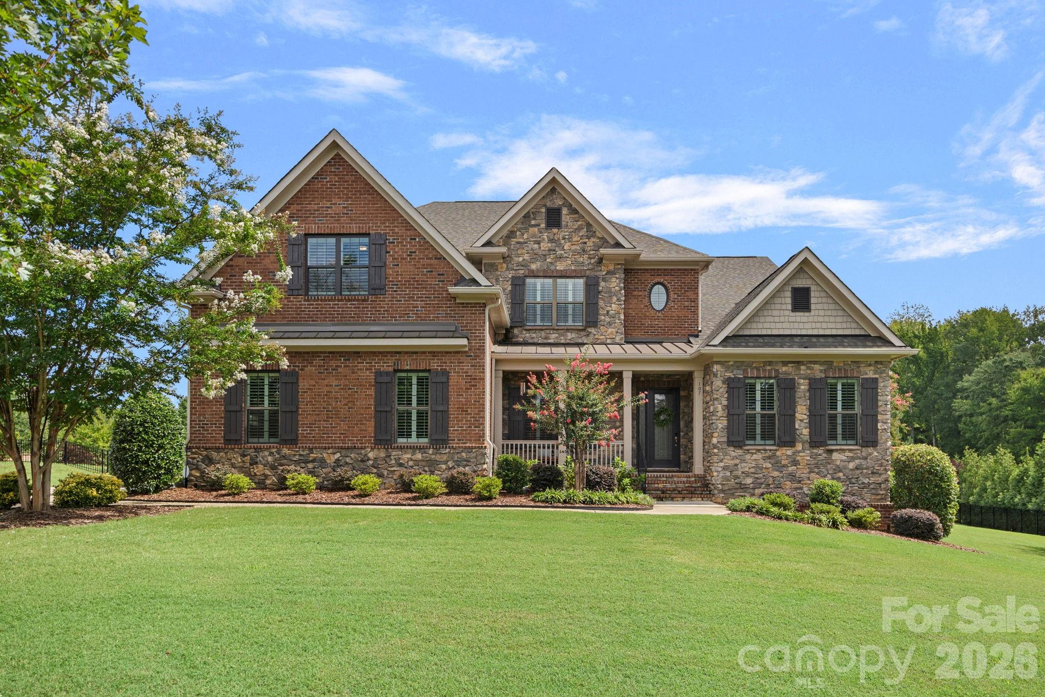 Set in the highly desirable village of Marvin, this beautifully appointed home combines a thoughtfully designed floor plan with gracious living spaces, beautiful updates, and exceptional space for both everyday living and entertaining! The main level features a primary suite, dedicated home office, gracious living spaces, and a beautiful sunroom overlooking the landscaped backyard. The bright, beautifully appointed kitchen features a center island, granite countertops, gas cooktop, stainless steel appliances and a large walk-in pantry, with an easy flow into the surrounding sunroom and living spaces. A butler’s pantry adds additional storage and serving space, while hardwood floors, extensive millwork and plantation shutters add warmth and character throughout the main level.The primary suite includes an adjoining sitting room or second office with its own beverage refrigerator and coffee bar, creating a private retreat or an additional workspace. Upstairs, a larger bedroom with a generous walk-in closet and private en-suite bath offers the flexibility of a second primary suite or private guest accommodations. Additional bedrooms and a large bonus/family room provide even more options for living and gathering. Laundry on both levels adds another level of convenience.Outdoor living is equally inviting with a beautiful flagstone patio featuring outdoor lighting, seating, and a grilling area overlooking the large, level backyard. Recent improvements include a newer downstairs HVAC system (2024), new hardwood flooring on the upstairs landing, hallway, and bonus room, plantation shutters throughout, upgraded light fixtures and ceiling fans, irrigation, extensive landscaping, and a spacious garage with built-in cabinetry and epoxy flooring. Additional features include a drop zone with built-in lockers, tankless water heater, granite countertops in all secondary full baths, and wiring for surround sound.Situated on a premium .68-acre lot, 107 Barlow Street offers an exceptional combination of space, flexibility and thoughtful updates in a community with an approved and fully funded GATED entrance planned for future installation. Come experience this exceptional Marvin home for yourself!