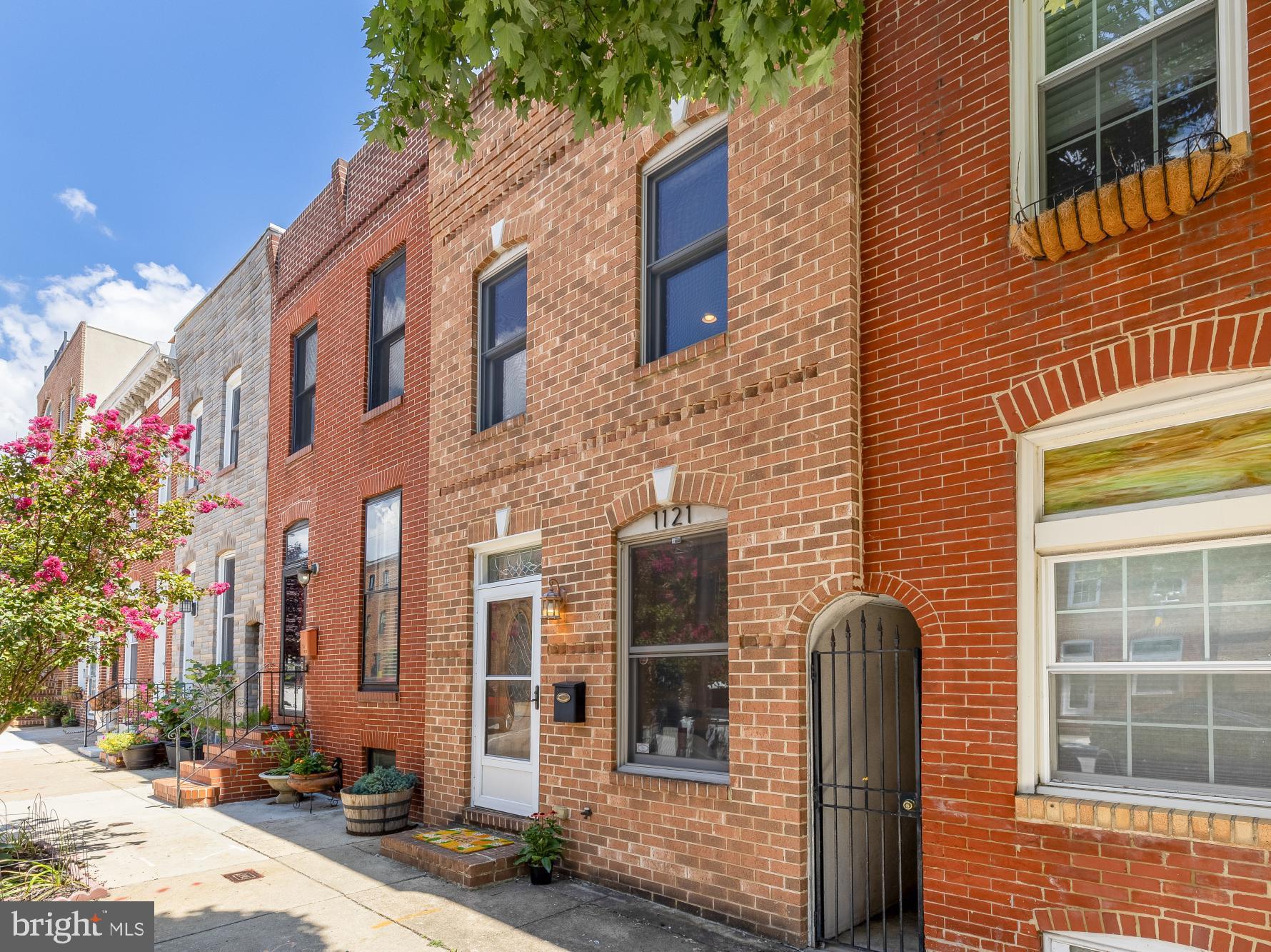 Just a few short blocks from the Canton Waterfront Park and O'Donnell Square, 1121 S. Clinton Street offers the best of city living in one of Baltimore's most sought-after neighborhoods. With 2,600 square feet of space with an attached garage, this is a rare opportunity to own a home with exceptional space and convenience, all for under $500,000. Enjoy easy access to neighborhood favorites, waterfront walks, Patterson Park, and some of Baltimore's best restaurants, shops, and cafés, all just moments from your front door.Inside, the open living and dining areas with hardwood floors flow into a spacious kitchen, with a charming nook that's perfect for a coffee bar or cocktail station. At the rear of the home, you'll find a half bath, a dedicated laundry room, and multiple storage closets that create the perfect mudroom entry from the garage.Upstairs are three generously sized bedrooms, including a spacious primary suite with a walk-in closet and an en-suite bath with a soaking tub and a separate shower. The unfinished basement offers abundant storage, while recent updates include a new water heater (July 2026), recoated roof (July 2026), fresh interior paint throughout (July 2026), and new carpet in every bedroom (July 2026).With 2,600 square feet, an attached garage, and an unbeatable Canton location, all offered for under $500,000, this is a rare opportunity you won't want to miss. Schedule your private showing today!