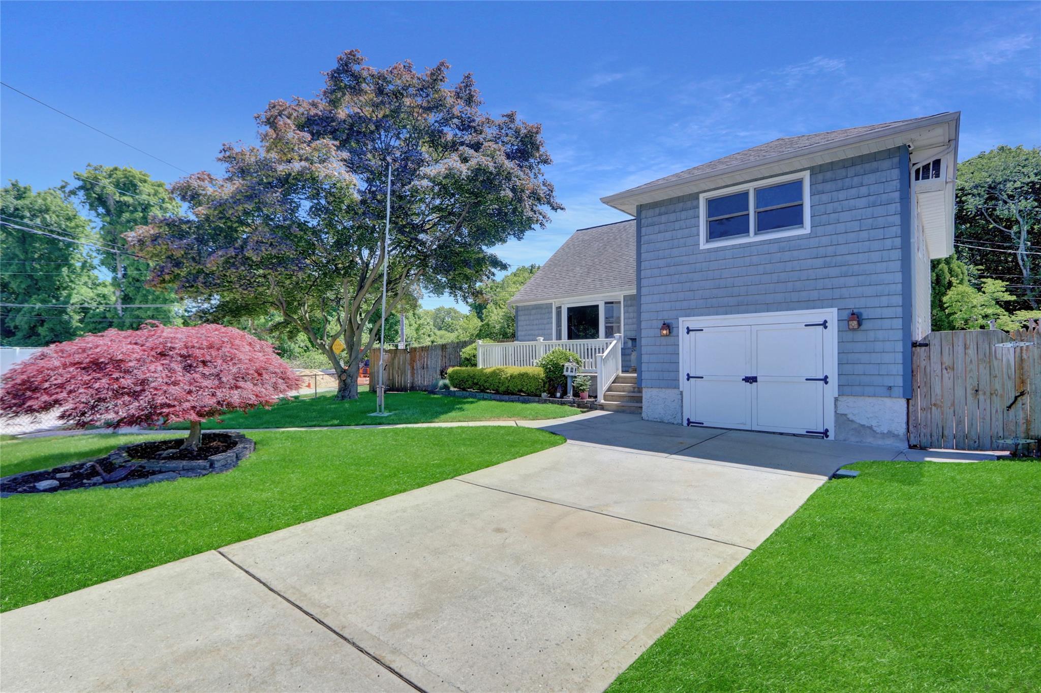 This Split Style home is situated on a private corner with wrap around endless street parking + 2 car driveway. Enter into a spacious living room with beautiful hardwood floors. The dining room has a buffet and opens into the spacious kitchen. The third floor features 2 nice size bedrooms and brand new bath! Third bedroom on the 4th level includes a den, laundry room, bedroom, and full bath. Down to the finished basement with plenty of closets for storage and a workshop. The back yard is equipped with a Salt Water in ground pool, patio, deck and still an grassy yard area! The back yard also backs up to a private wooded area for increased privacy.