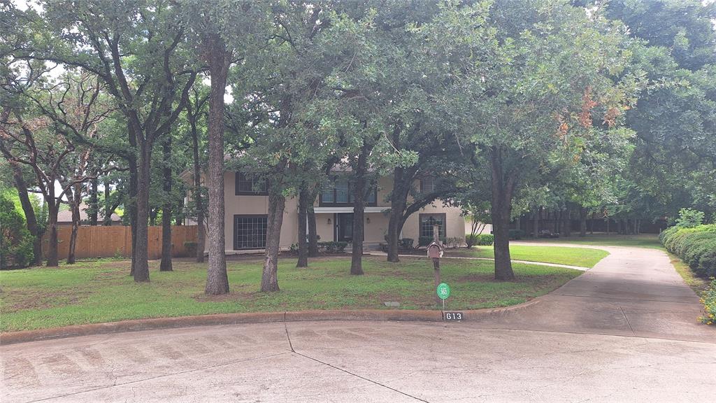 Bring your updating style to this one family owned home on beautiful, treed culdesac lot in quiet, small, established, NO HOA, Oaks of Colleyville.  This home offers vintage character with modern updates NEW roof, 3 zoned Trane hvac units, stainless kitchen appliances, 3 ample size full baths, 2 half baths, extensive driveway paving to access side entry 1 car & 2 car garages & 13x35 RV garage. Huge side yard to right of driveway perfect for guest house or workshop addition. Bring your rockers to this southern style welcoming front porch with gorgeous front door.  Split spacious and versatile formals at the entry with natural light streaming thru the big windows.  Inpressive great room with soaring 2 story ceilings, wet bar, built in bookcases flank FP, library panel accent wall, 2 ceiling fans & 2 story bay window wall of windows that view backyard 50x20 entertainment patio.  Plenty of space to add a pool on either side of raised pergola with cabana pool bath. Open concept living, breakfast, kitchen and dining. Kitchen has  planter window above sink, coffee bar, 2 pantries, smooth downdraft cooktop,  powder bath & exit door to garage. First floor master has french doors to backyard, 2 WI closets, tray ceiling with crown mold accent & decorative fan, spacious bath with makeup vanity between 2 sinks, jet tub with lead decorative glass window above & private toilet room with linen closet & roll in shower with glass block window.  Upstairs has  4 more spacious rooms with fans, WI closets & 2 fulls baths.  North wing has rear motherinlaw BR2 with ensuite bath and front BR3 with  king furniture.  South wing BR 4&5 with ensuite bath between is currently used as 2nd floor front office with 2 closets & rear BR4 with french door to treetop 11x11 concrete patio.