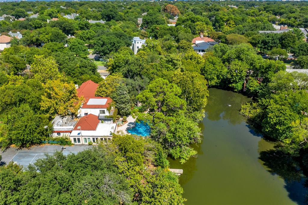 This prime property, located in the prestigious Preston Hollow neighborhood of Dallas, presents a rare opportunity for custom construction on a spacious 1.41-acre gated estate lot situated on a private lake. This exclusive estate lot is nestled amidst a lush landscape of mature trees, creating a tranquil and picturesque setting for a dream estate tailored to your preferences.

Access to this exceptional property is granted through two secure gates, ensuring both convenience and security for its future residents. The existing home is considered to have no value and will not be available for viewing. The true value of this offering lies in the extraordinary land and its serene surroundings.

Centrally located on the prestigious Preston Road, this property enjoys a prime position in the heart of Preston Hollow. Its proximity to the private school corridor, as well as Dallas' finest shopping and dining establishments, adds to the desirability of this location.