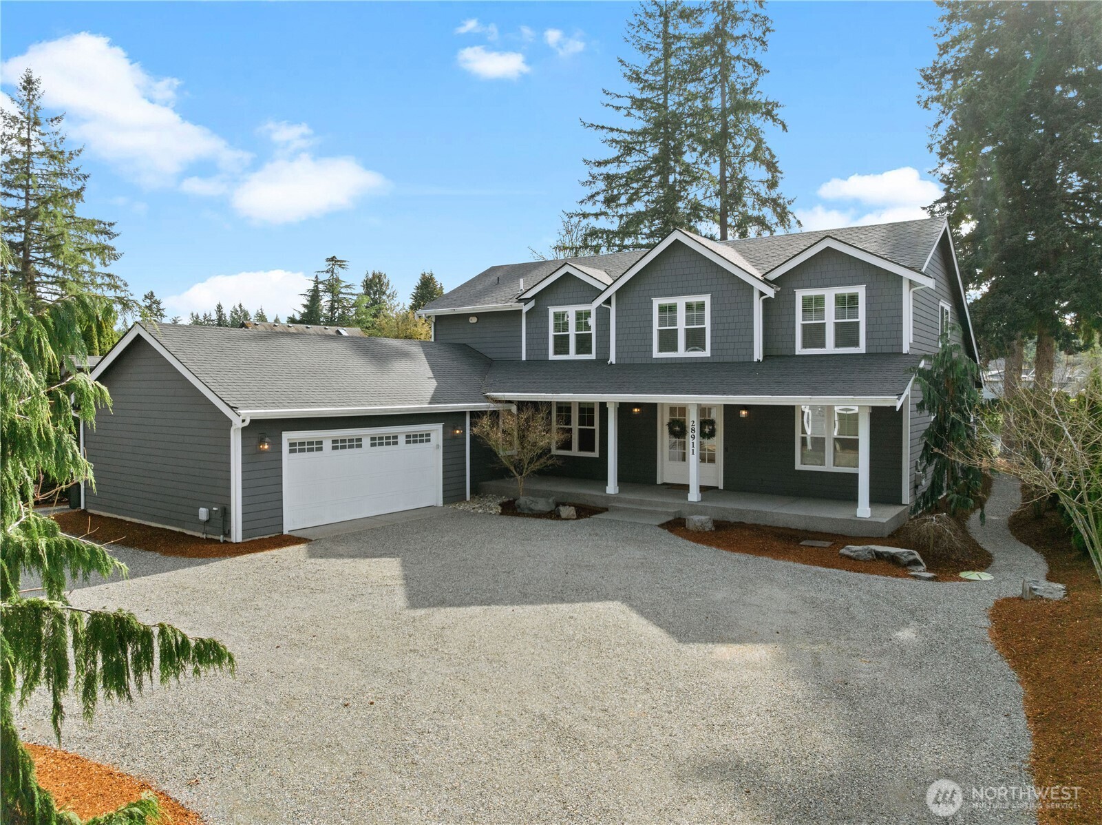 Welcome to this stunning Lake Sawyer home, where timeless design meets modern comfort. The main floor showcases beautiful white shiplap and soaring vaulted ceilings, creating a bright and inviting living space. Enjoy the convenience of a main floor primary suite, plus an additional bedroom and full bath—perfect for guests or multi-generational living. The thoughtfully designed kitchen includes both a butler’s pantry and an additional pantry for ample storage. With 5 bedrooms plus a spacious bonus room, there’s room for everyone to live, work, and play. A rare and incredibly versatile 2400sq ft shop elevates this property to a league of its own. Currently outfitted with an indoor basketball court and 2 office spaces, this expansive space offers endless possibilities—use it as a premium RV garage, a dream setup for car enthusiasts, a workshop, home gym, entertainment space, or convert it into a second dwelling unit for guests, multi-generational living, or potential rental income (buyer to verify). Nestled on Lake Sawyer, this home offers the perfect blend of style, space, and serene lakeside living.
