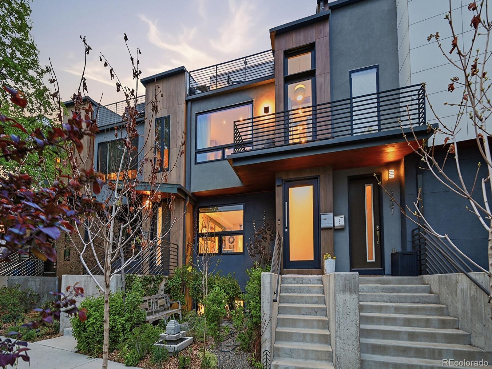 A rare offering in the heart of LoHi, this architecturally reimagined home is like no other and has been crafted for the discerning buyer who demands design, quality, and individuality. Though part of a quadplex, this home lives entirely apart, offering a level of elevated finishes and customization rarely seen in attached living with No HOA.Entry begins with a striking artisan-crafted Pivot door, opening to a meticulously designed level with designer tilework, a private guest suite, en-suite bath, and laundry.The home unfolds as a curated architectural experience. A dramatic staircase clad in designer tile and framed by custom metal railings and glass balustrades creates a sculptural focal point—an interplay of texture, light, and modern design.The main level offers a refined, light-filled living space with hardwood floors and tilework from Ann Sacks, Porcelanosa & The Tile Store and flows to a private Australian teak terrace.The gourmet kitchen features Sub-Zero, Wolf, and Cove stainless appliances, cabinetry from Concept 32, a quartzite waterfall island, wine refrigeration, and a dedicated ice maker.Upstairs, a dramatic skylight fills the stairway with natural light, leading to the primary suite—a serene private retreat defined by a custom glass wall and spa-caliber bath with steam shower, Kohler soaking tub, and private room with smart toilet.A private rooftop deck showcases expansive views and city lights, offering an extraordinary setting to savor above the city.The finished garden-level residence offers flexibility for guests, multigenerational living, or income potential, complete with a designer-curated kitchen and bright bedroom with spa-inspired en-suite. Additional features include Marvin windows with stone sills, whole-home Sonos audio, multi-zone climate control, tankless water heater, and a finished two-car garage. This residence is a true statement home in one of Denver’s most dynamic and sought-after neighborhoods.