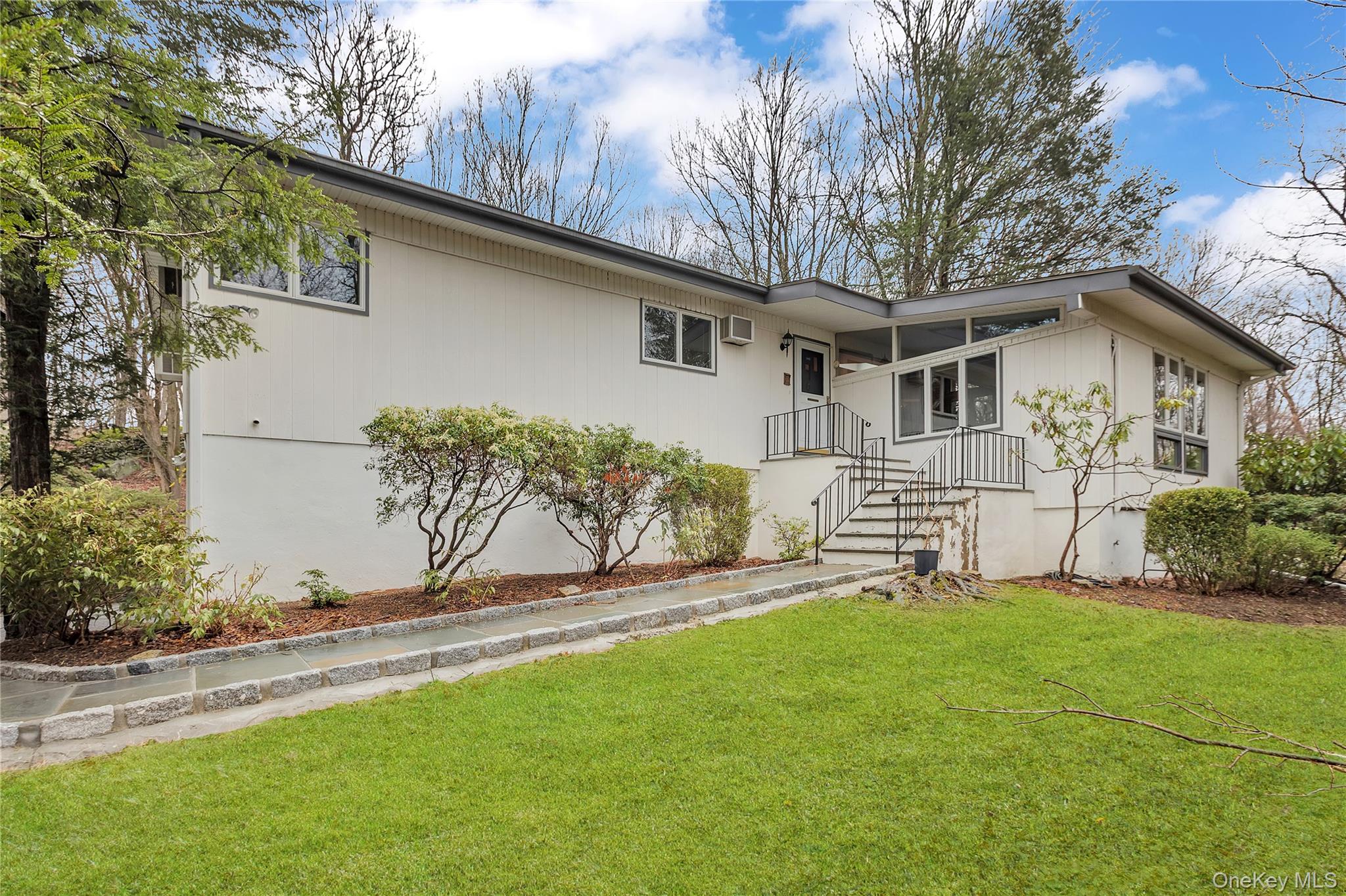Modernist living meets woodland privacy. This unique Mid-Century Modern gem tucked away at the end of a meandering driveway lined with Belgium Block. Surrounded by 2.39 acres of nature, this home embraces the perfect setting tucked away but close to all! As you enter, you’re greeted by a step down, dramatic sunken living room featuring surround  windows that frame the outside and invites it in!  Hardwood flooring awaits under the carpets!The open-concept flow continues into a cozy gathering space with a classic fireplace just off the kitchen—ideal for morning coffee or evening cocktails. A formal dining room, with a beautiful view of the outside, a full hall bath, three spacious bedrooms including the primary offering a large walk in closet and en-suite which is a true retreat!     The lower level offers incredible versatility: a large recreation space, a dedicated home office, or yoga room, 4th bed plus  sliders that lead directly to the yard. You'll also find a third full bath and an unfinished area—perfect for a custom wine cellar or seasonal storage.Experience the privacy, the light, and the timeless style of Watch Hill Road. Close to schools, town amenities, shopping and 10 minutes to Metro-North station for NYC trains.