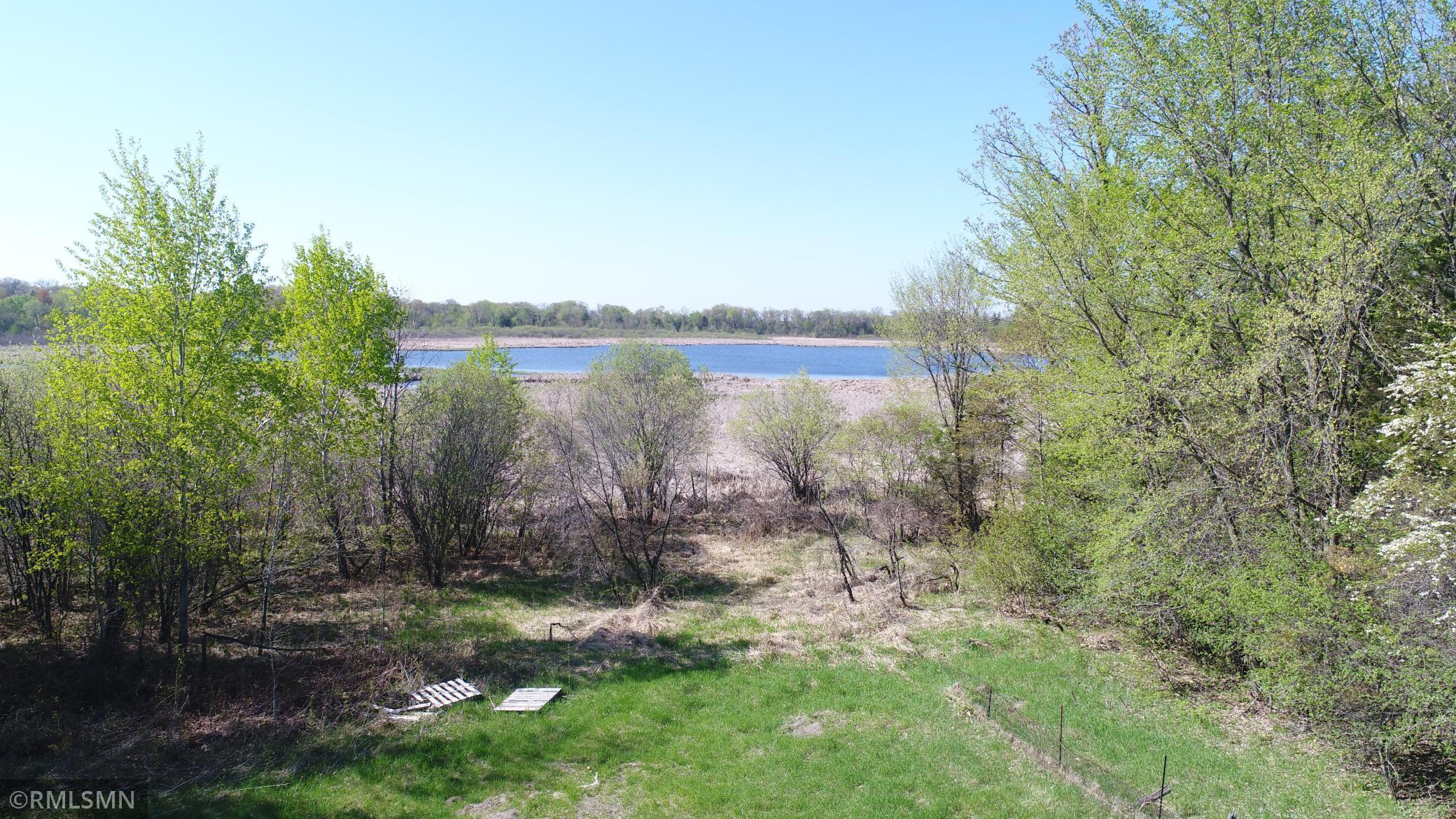 Great land, over 10 acres beautiful hardwood trees, level, hilly and low land, and an environmental lake. Absolutely gorgeous views. Trees for privacy upfront then land opens up, walk down to the lake and enjoy the peace, tranquility, and scenic views. Land extends into the lake area. If you click on the map, it will give you an idea of water frontage appears to be about 300 ft. Build your dream home. Copy of property map and survey in supplements. House number directly to the north is 10710 for GPS