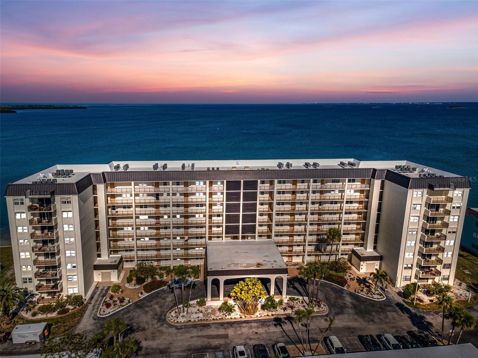 Coastal Living At Honeymoon Island! Welcome home to # 312 at the completely updated 9 Haig building at the stunning Royal Stewart Arms. All milestone Inspections completed and repairs fully done and already paid for and the building looks absolutely amazing with its brand new Fresh look!  You will love the super spacious corner/end unit condo with a sprawling 1181 sq ft of living space with an open floor plan offering versatile options to maximize the use of space for your lifestyle. Stunning new laminate wide plank floorings adorn the living main space and comes with open views of the exterior through the hurricane proof sliders with direct access to your own balcony which is the perfect place to enjoy morning coffee and enjoy sunrise water views of St. Joseph sound or to relax while sipping your afternoon favorite cocktail. The condo offers a split floor plan with a very spacious owners suite with beautiful bamboo flooring, plenty of windows and lots of filtered natural daylight and is large enough to accommodate a California king bed and plenty of room for additional furnishings. The primary en-suite comes with a huge walk-in, additional storage space, an awesome and large mirrored vanity with smart use of storage. The chef of the family will love the large remodeled kitchen with new customized cabinetry with smart functional storage space/ built-ins , SS appliances, upgraded pure marble tops, large window for more daylight and plenty of space for a dining table. The guest bedroom has direct views to the exterior, a large closet and vinyl floorings and is adjacent to the guest bath. Lots of improvements during ownership to include new AC and hot water heater too! RSA is a vibrant 55+ community that is full of activity. A wonderful waterfront pool and clubhouse that encompasses a gym, sauna, card room, party room, and kitchen. Do you like to fish? Play tennis? How about a little shuffle board? They are all right there for your use. The Dunedin Causeway is the perfect route for your daily stroll, kayak trip, or bike ride. This little slice of paradise has all that Florida living has to enjoy... right in your own back yard!! The unit comes with a 3x5 dedicated storage on the same floor.