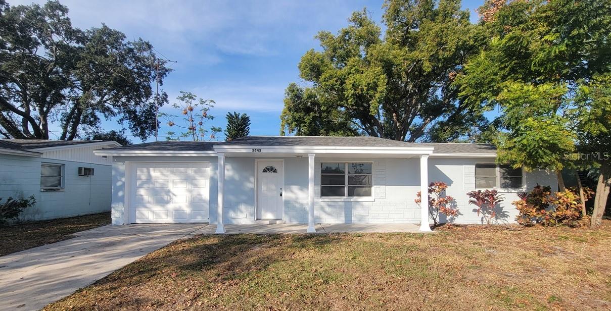 This charming 2-bedroom, 1-bath home features a 2023 roof, fresh interior and exterior paint, and no carpet throughout. The updated kitchen offers brand-new cabinets and countertops, and the full bath includes a new vanity. A separate dining area opens to a bonus enclosed Florida room with access to the fully fenced backyard. Enjoy both covered front and back porches, perfect for relaxing or entertaining. The one-car garage provides washer/dryer hookups and even a convenient bonus toilet. With just a little personal touch, this property is ideal as a first-time home or a great investment opportunity.