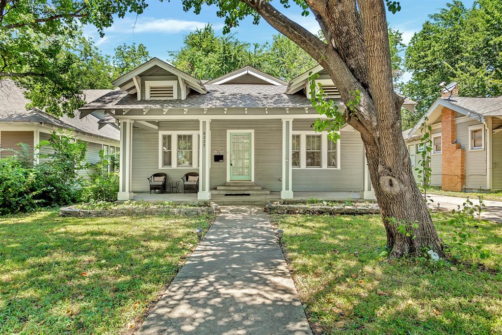 Own an important piece of history with this 1915 Craftsman in one of the oldest communities in Dallas, Steuerwald's Addition. This area was platted and filed in 1903 and is now a conservation district. The house was fully renovated and upgraded in 2018, windows, floors, framing, drywall, siding, plumbing, HVAC, insulation, tankless water heater, new deck, kitchen, and bathrooms, new roof in 2021. The charm begins at the curb when you arrive and encourages front porch sitting, pitcher of tea, waving at the neighbors. The floor plan is spacious and open. You enter through the living room with the original, but now decorative, fireplace, and continue into the dining room and kitchen. The kitchen has stainless appliances, gas cooking, quartz counters, a pantry, and plenty of cabinets for storage. Continuing out the back door there is a large covered deck that can also be accessed by the primary bedroom. The back yard is large and fenced, and the owners recently installed a custom gate. There is a garage in the photos, this is used primarily for storage, but you could rebuild the garage and be able to access it through the new gate. Back inside is the primary bedroom and bath. The house was originally a 3 bedroom. The wall between the primary and second bedroom was removed, creating a large open primary bedroom that would make a perfect office or nursery space in the primary, or could easily be reconverted to a third bedroom. The primary bathroom has dual sinks and separate water closet and standing shower that is easy to access. The second bedroom is large and faces Worth, off the hallway with the second bathroom. The second full bath has a tub and built in cabinets. Many of the large expensive items that come with a home and neighborhood this age have already been replaced, even the gas and sewer line. Imagine all the stories this property could tell. It is very exciting to see a new owner continue to care for and add to the history and story of this gorgeous home!