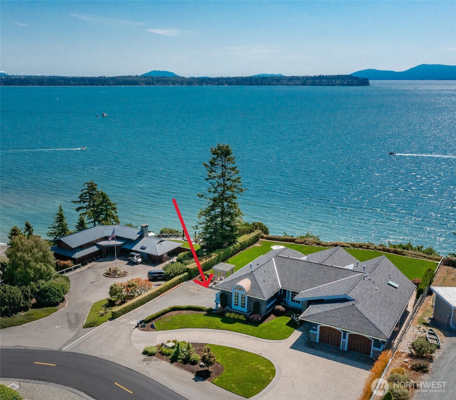 Discover the extraordinary—a masterpiece on .55-acre w/123 feet of waterfront. Offering breathtaking 270-degree views of Mt. Baker, Birch Bay, San Juan & Gulf Islands. Not just a residence; it’s an unparalleled lifestyle. From the moment you step inside, the meticulous details & finish work leave a lasting impression. Thoughtfully designed to create a sense of functional luxury. The main level showcases a floor plan made for both grand entertaining and quiet relaxation against the backdrop of those stunning water views. Gourmet kitchen w/Miele & Sub-Zero, wet bar for effortless evening vibes while taking in sunset skies. Entry level includes the primary retreat w/spa ensuite, custom walk-in closet (with private laundry), fireplace & panoramic vistas. A second ensuite on the main is versatile, perfect for guests or office. Lower level brings everyone together at the cherrywood bar or spacious media room, inviting good times and memories. 2 additional guest bedrooms, full bath, fireplace & utility room with separate entrance for convenience. Outside, the magic continues—host unforgettable summer soirées, or wander to the nearby steps for beach access. The lifestyle of Birch Bay Village : marina, golf course, clubhouse, pool, pickleball/tennis, social clubs, private beaches/parks & 24/7 gated security—all accessible by golf cart. Room for boat/RV parking & more. This home is a rare fusion of coastal charm & luxury, designed for a vacation lifestyle everyday of the week!