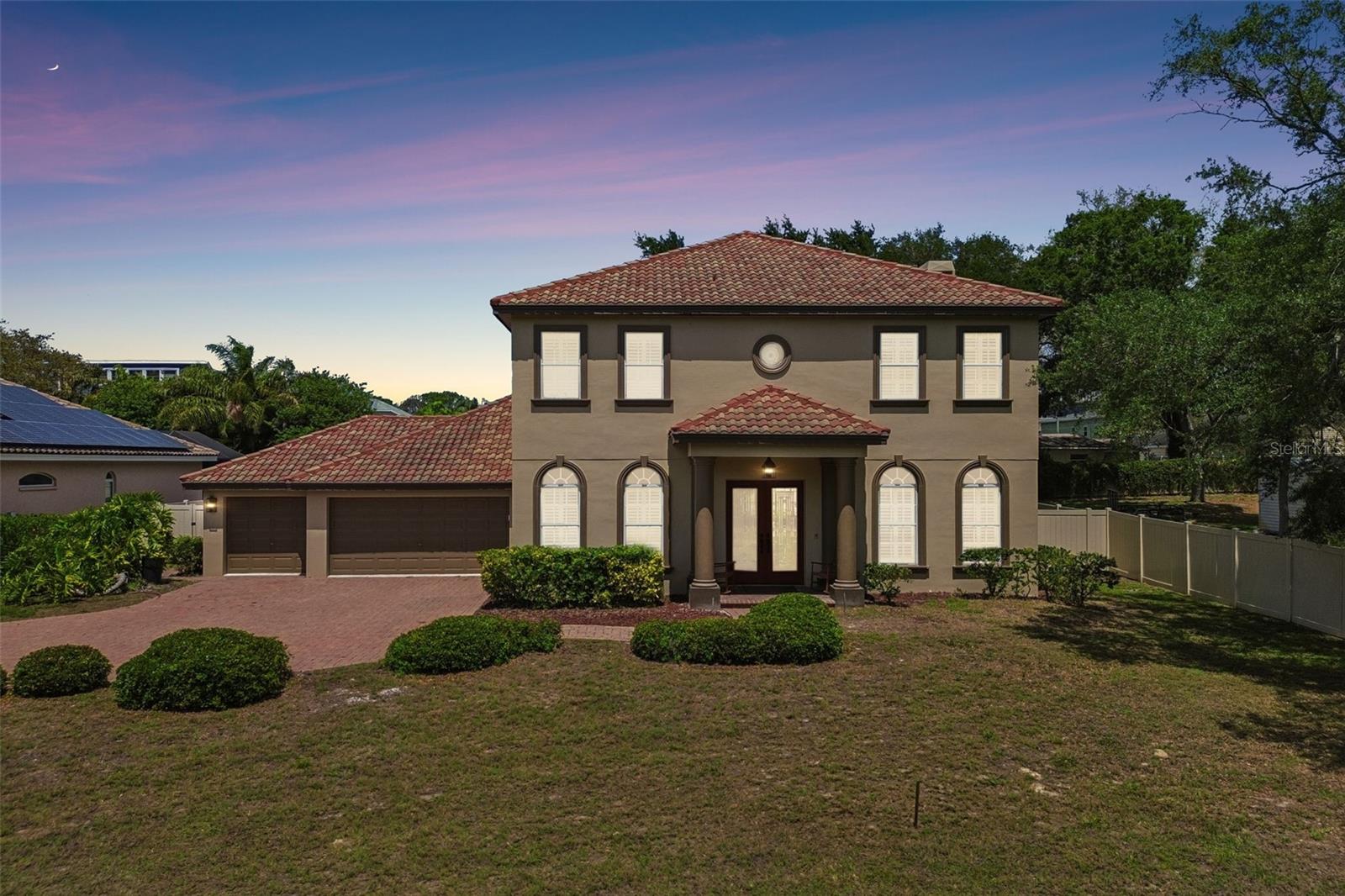 Welcome to 471 Kali Court — a truly exceptional, fully reimagined residence in the heart of Palm Harbor. This spacious, designer-curated home blends timeless character with high-end modern upgrades, offering a completely turnkey opportunity for the most discerning buyer.You can walk or golf cart to Crystal Beach park for amazing sunsets and fun events with all of the benefits of coastal living but, no flood insurance required and no flood damage! Step inside to discover a stunning, brand-new kitchen featuring elegant marble countertops, premium finishes, and a layout designed for both everyday living and entertaining. The home boasts four fully remodeled bathrooms, each thoughtfully designed with luxurious materials and top-tier fixtures.The first floor showcases beautiful new wood flooring, while the second level offers plush new carpeting for added comfort. Unique architectural details elevate the home, including antique fireplace mantels adorning both the main living room fireplace (wood or gas) and a cozy gas fireplace in the primary bedroom sitting area.A true showstopper awaits behind a hidden door — a private speakeasy-style home theater complete with surround sound, perfect for unforgettable movie nights or entertaining guests. For work, the first floor also features a home office with two sets of arched, antique french doors. Step outside to your own private retreat, featuring a screened-in pool and hot tub, an outdoor kitchen, and a completely redone pool enclosure — ideal for enjoying Florida living year-round.Additional upgrades include a new HVAC system and a new tankless water heater for efficiency and peace of mind. The home is topped with a durable tile roof. Offering the perfect blend of luxury, comfort, and thoughtful design, this home is truly move-in ready. Furnishings are negotiable, providing a rare opportunity to acquire a fully styled, high-end residence or an amazing short term rental .Don’t miss your chance to own this one-of-a-kind Palm Harbor gem in Palm Harbor University School district.