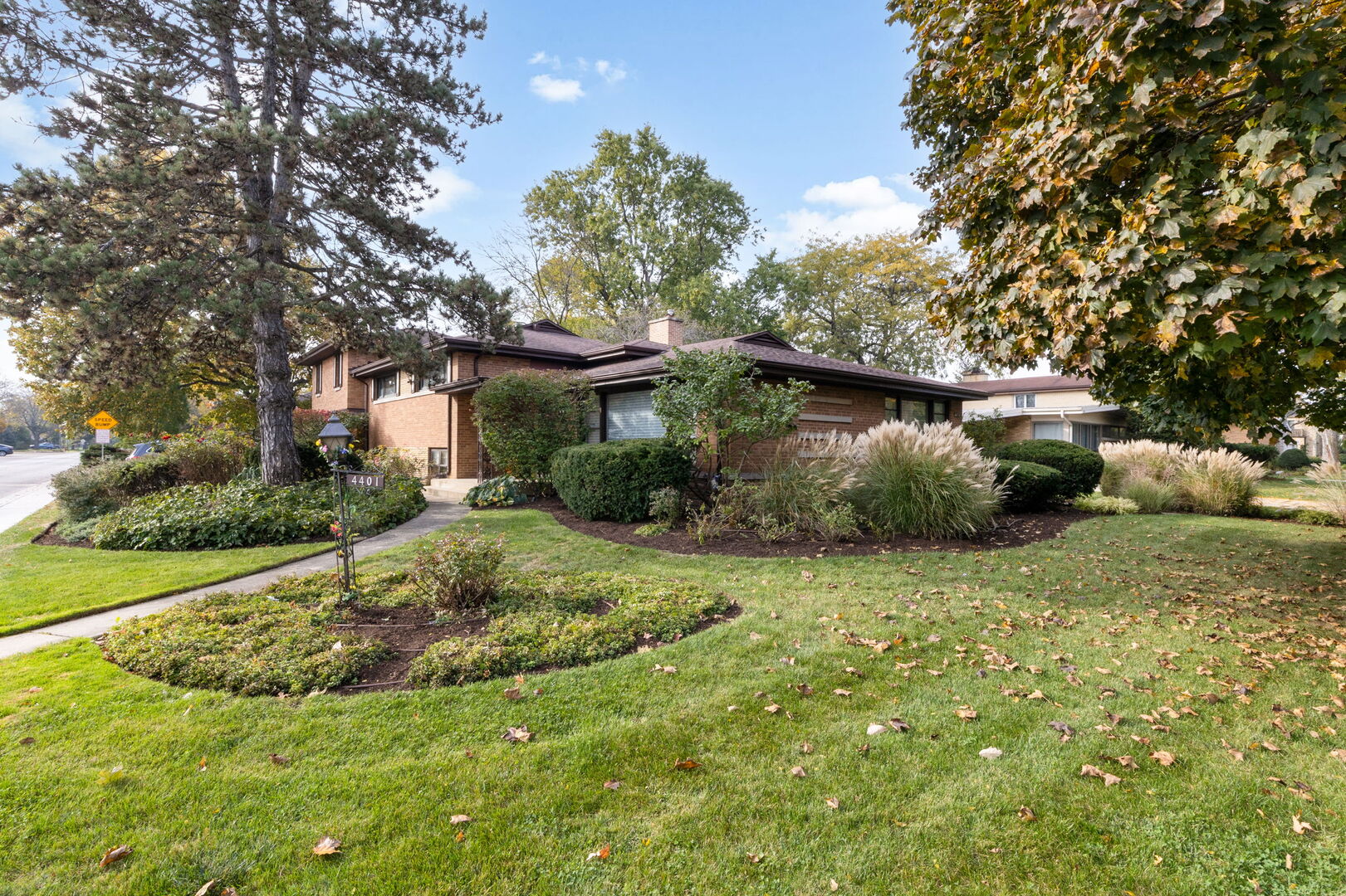 First time on the market! Exceptional mid-century 4-bedroom, 3.5-bath residence ideally situated on a prominent corner lot directly across from Proesel Park in sought-after Lincolnwood.    The main level offers spacious, light-filled living and dining rooms accented by beautiful hardwood floors, creating an inviting setting for both everyday living and entertaining. The eat-in kitchen features Corian countertops, a Sub-Zero refrigerator, new double ovens, and cooktop, and a bright breakfast area overlooking the yard.    Unwind in the charming wood-paneled den complete with custom built-ins and an electric fireplace. Just a few steps down, the expansive family room impresses with newer carpeting, custom paneling, and a wet bar, making it the perfect gathering space. This level also includes a dedicated office, laundry room, and utility room.    The lower level offers a large crawl space providing abundant storage. On the second floor, you'll find three generously sized bedrooms and two full baths. A private upper-level retreat is home to the magnificent primary suite, featuring custom built-ins, a spacious walk-in closet, and a luxurious en-suite bath designed for comfort and relaxation.    Additional highlights include an attached 2-car garage, a private backyard patio, and an unbeatable location with easy access to recreation, shopping, dining, and transportation.    A rare opportunity to own a home that combines timeless mid-century character with generous living space and an outstanding location.