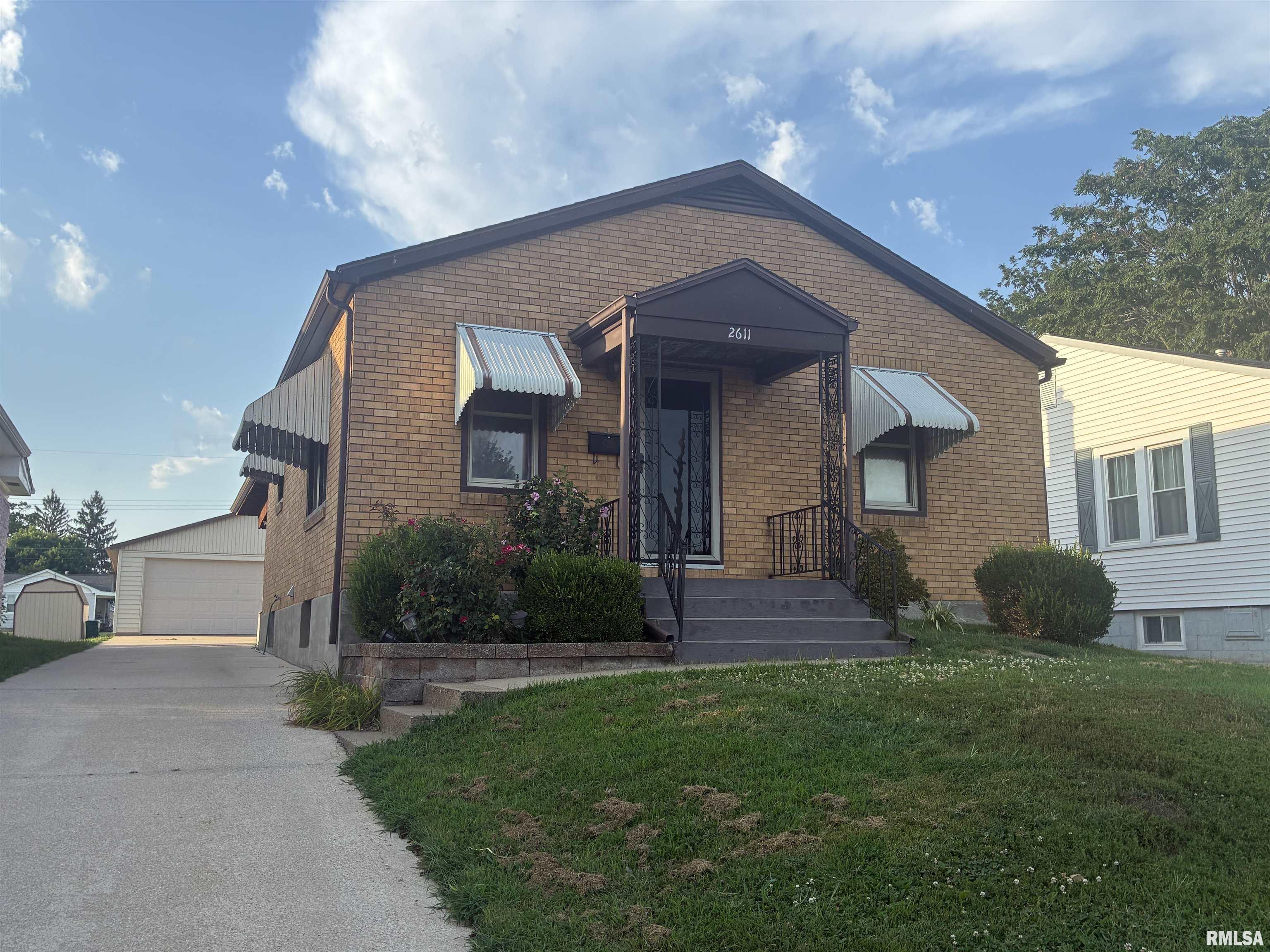 Attention garage lovers!! This fabulous 24 x 40 foot garage with an fabulous shop. comes with a 3 bedroom 2 full bath brick home. Full finished lower level. Updated baths. Vinyl replacement windows. and more.  Walk out of this all brick home to your private covered deck.