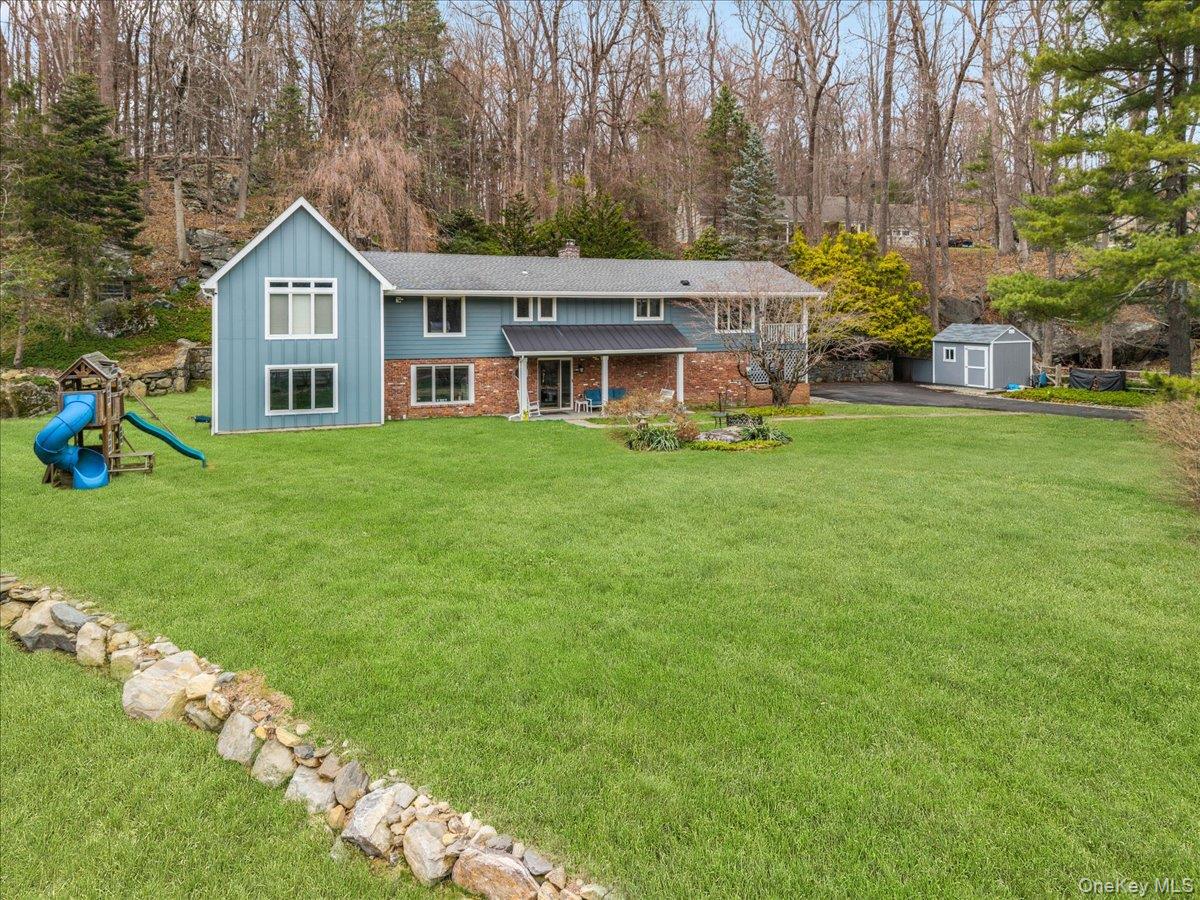 Welcome to 1 Fox Ridge Road in the beautiful Windmill Farms section of Armonk! This four bedroom, four full bathroom home has all the features, space, areas and more the modern buyer is looking for with an expansive and level front yard. Three full bathrooms upstairs, one full bathroom downstairs. Luxurious white oak hardwood floors throughout. Original stone wood burning fireplace in living room with brand new insert. Sparkling gourmet kitchen with quartzite backsplash/countertops and KraftMaid cabinets. Beverage fridge and storage in island. Two convection ovens (one with air fryer feature). Recently restained covered deck off the dining area - enjoy a barbeque or a morning coffee in your personal treehouse-like retreat. New master suite - ensuite with walk-in closet, spa-like bathroom has a free standing tub with serene views plus a rain shower and double sinks. Three additional bedrooms upstairs, perfect for guests, work-from-home and everyday living. Stone patio and Jacuzzi accessible from upstairs bedroom with sliders. Light, bright, recently expanded walk-out lower level to private side yard. Tons of storage: double attics plus expansive laundry/storage room, garage and exterior shed storage. Alarm system. Updates include: brand new HVAC system, new playroom, all new bathrooms, new water heater, newer roof, many new windows throughout. Close to Byram Hills High School, The Summit Club at Armonk, Route 22 and I-684, Armonk's many local day-camps and stunning nature trails for the outdoors lover. Enjoy luxury shopping, dining, refreshment, fashion and more in downtown Armonk. A must see home!