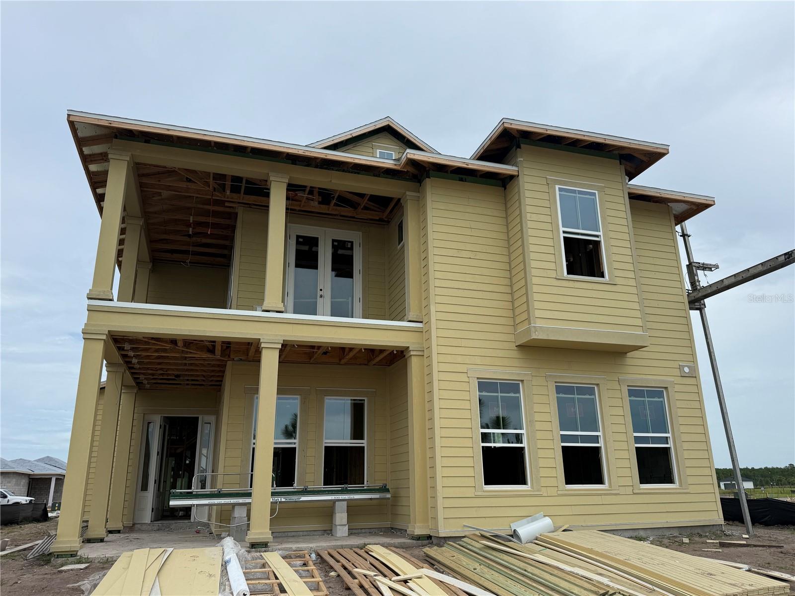Under Construction. Welcome to the Fiji, a stunning custom-crafted home offering over 3,100 square feet of thoughtfully designed living space in the heart of Laureate Park. Blending sophisticated style with everyday comfort, this four-bedroom, three-and-a-half-bath residence was designed for the way today's families live, work, and entertain. The open-concept floor plan centers around a gourmet kitchen featuring premium appliances, a hidden pantry, and an oversized island that overlooks the spacious living and dining areas. Large sliding glass doors open to the covered lanai, creating a seamless transition between indoor and outdoor living. The private first-floor owner's suite serves as a luxurious retreat with dual walk-in closets and a spa-inspired bath complete with dual vanities and walk-in shower. A nearby flex space offers endless possibilities for a home office, fitness room, or library. Upstairs, three additional bedrooms and an oversized game room provide plenty of space for family and guests. As one of Florida's premier custom builders, you can create a home that can be personalized to fit your lifestyle, delivering a level of flexibility, craftsmanship, and quality rarely found in new construction. Beyond the front door, enjoy the award-winning Laureate Park lifestyle with resort-style pools, fitness center, tennis and pickleball courts, miles of scenic trails, neighborhood restaurants, community events, and high-speed fiber internet included in the HOA. Located minutes from Medical City, Orlando International Airport, and all that Lake Nona has to offer, this home combines luxury living with one of Central Florida's most vibrant communities.