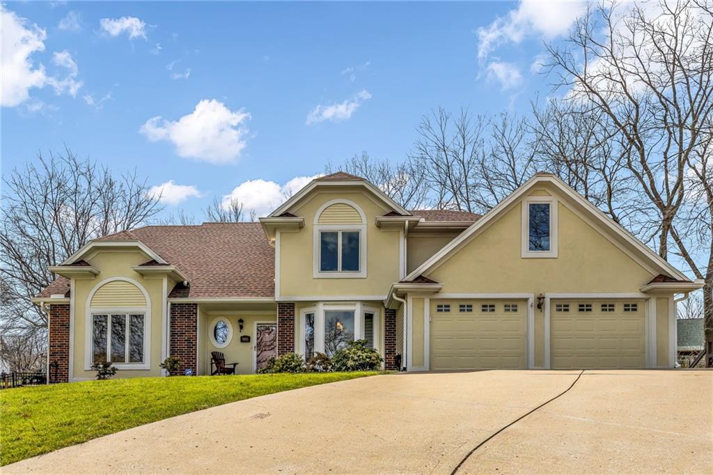 Welcome to fabulous Weatherby Lake! This 1.5-story home offers 4 bedrooms, 4.1 bathrooms, and 3 garage spaces, combining spacious interiors with a thoughtful layout designed for everyday living and entertaining.The main level features an open-concept dining room, great room, breakfast area, and kitchen, creating a natural gathering space at the heart of the home. The main-floor primary suite provides a private retreat with a spacious bathroom and convenient main-floor living. Just off the breakfast area, the fully enclosed three-season porch and patio are perfect for morning coffee or evening relaxation while overlooking the fully fenced backyard.Upstairs, a large loft provides flexible space for a secondary family room, study area, or playroom. Two generously sized bedrooms, each with private en suite bathrooms, complete the upper level.The finished walkout basement expands the home’s versatility with a fourth bedroom and full bathroom, an office or exercise room, a front/back bar, and multiple gathering areas for entertaining or relaxing. The oversized third-car garage/workshop offers additional storage and space for hobbies, projects, or lake gear.The home’s location is one of the best in the community with convenient access to Thompson Park/playground, tennis and pickle-ball courts, and A1 Cove, featuring picnic facilities and a courtesy/swim dock.As part of the Weatherby Lake community, residents enjoy access to a 274 acre private lake for boating, swimming, fishing, kayaking, and paddle-boarding, along with parks, playgrounds, trails, civic groups, and year-round community events that make this neighborhood one of Kansas City’s most unique lifestyle destinations—all just minutes from Parkville, Briarcliff, Legends, downtown Kansas City, Johnson County, and KCI Airport.With expansive living spaces, lake access, and a nearby park, court, and cove, this home offers the size, location, and lifestyle that defines living at Weatherby Lake.