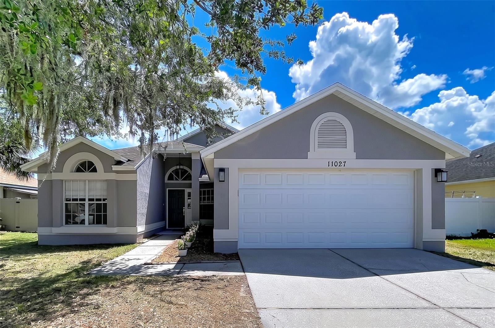 One or more photo(s) has been virtually staged. There’s a moment when you walk into a home and instantly know it just feels right. The light pours in perfectly. The layout flows naturally. You can already picture slow Sunday mornings, friends gathered around the kitchen, and long summer evenings spent by the pool. Located in Tampa’s highly sought-after Carrollwood area, this extensively and thoughtfully remodeled 3-bedroom, 2-bath pool home has been transformed from the inside out with an impressive full interior renovation. Nearly every surface, finish, and detail has been updated, creating a home that feels fresh, modern, and completely move-in ready. The open-concept floor plan was redesigned for the way people actually live — bringing together the kitchen, dining, and family spaces into one seamless, inviting environment. At the center of it all is the beautifully remodeled kitchen featuring updated shaker-style cabinetry, contemporary finishes, newer appliances, fixtures, and faucets, all blending style and functionality effortlessly. The renovations continue throughout the entire home with new flooring, fresh interior and exterior paint, updated lighting, new doors, upgraded toilets, sinks, fixtures, hardware, a newer HVAC system, new baseboards, new hot water heater, and a new garage door opener. Both bathrooms have been completely renovated with clean, modern finishes that make the entire home feel elevated and cohesive. The primary suite offers the kind of space that’s hard to find — oversized, comfortable, and complete with a generous walk-in closet and room to truly relax and recharge. Step outside and the lifestyle continues. The screened private pool creates the perfect backdrop for weekend gatherings, quiet evenings, and year-round Florida living. In this price range, finding a fully remodeled home with a private pool is increasingly rare. Even better, the expensive updates buyers worry most about have already been completed. No flood insurance required. Low HOA. And the location is exceptionally convenient with quick access to the Veterans Expressway — putting Tampa International Airport, downtown Tampa, and many of the Bay area’s best destinations less than 10 minutes away. Shopping, dining, and top-rated schools are all nearby, making everyday living easy. This is the kind of home buyers wait for — beautifully updated, ideally located, and ready to enjoy from day one.
