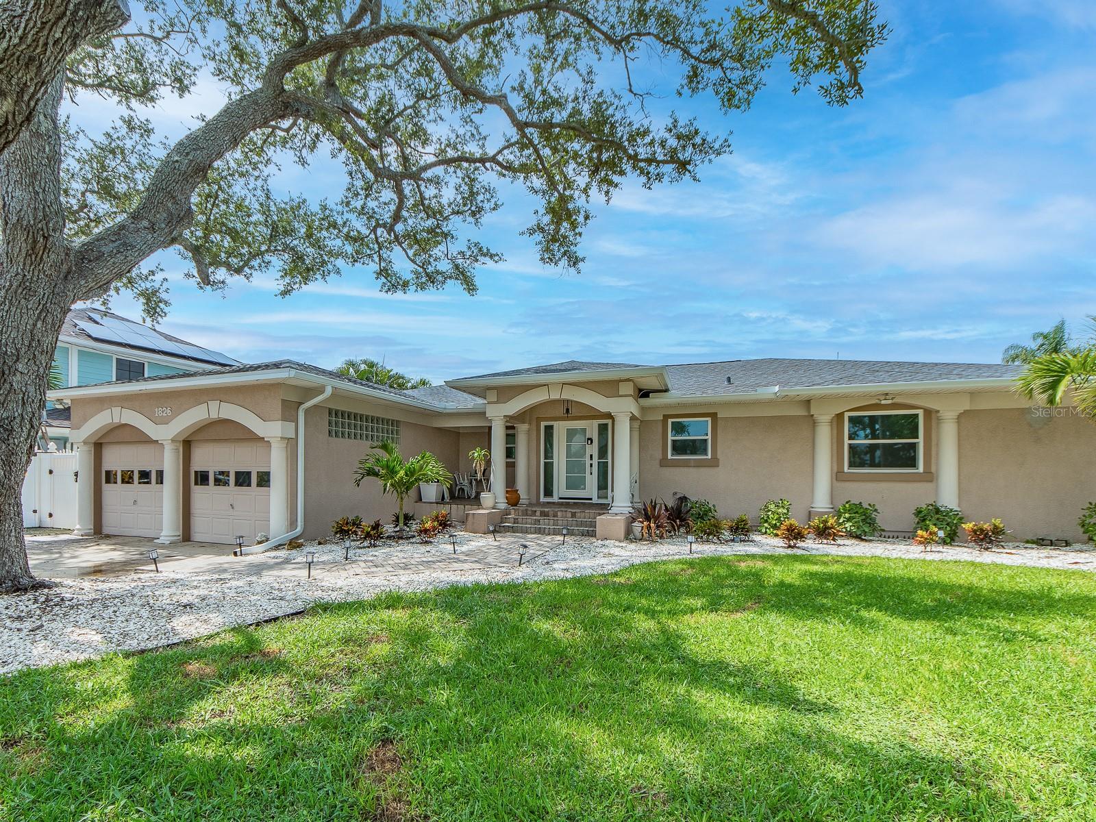 Million-dollar sweeping, mesmerizing views of the Intracoastal Waterway, Memorial Causeway, and the Clearwater Beach skyline set the tone for this elegantly remodeled, move-in-ready waterfront home. Designer finishes throughout enhance the light-filled interior, where floor-to-ceiling windows and sliding doors in the living room, dining room, kitchen, and primary bedroom showcase the stunning vistas.The open, spacious great-room floor plan features ceramic tile flooring throughout, creating an ideal setting for everyday living or entertaining. The sleek gourmet kitchen offers abundant cabinetry, quartz countertops, a JennAir refrigerator, Thermador stove, upgraded faucet, cooking/breakfast island, stylish backsplash, and a water filtration system. Custom lighting adds warmth and sophistication.The primary bedroom includes a beautifully updated en-suite bath with a modern walk-in shower, dual sink vanity, bidet, and a large walk-in closet. The second and third bedrooms are generously sized and share an attractively updated bath with both a walk-in shower and tub. An inside utility room with washer, dryer, and additional storage adds convenience. All windows are equipped with electric blinds for effortless comfort and privacy.Enjoy peace of mind with major updates already completed: Roof (2025), AC and ductwork, windows and sliding doors, water and gas lines, insulation, and flooring.The backyard is a private waterfront retreat perfect for relaxing or entertaining, featuring a saltwater pool, pool bath, wooden deck off the dining room, and spectacular water views. Experience breathtaking sunsets, dolphin sightings, and serene nature watching. For boating enthusiasts, the private composite dock—equipped with electric and water—provides easy access to the Intracoastal Waterway and Gulf of Mexico.Located close to Coachman Park, The Sound Amphitheater, Capitol Theatre, premier dining, shopping, beaches, and all the amenities Clearwater offers. Florida waterfront living at its finest.