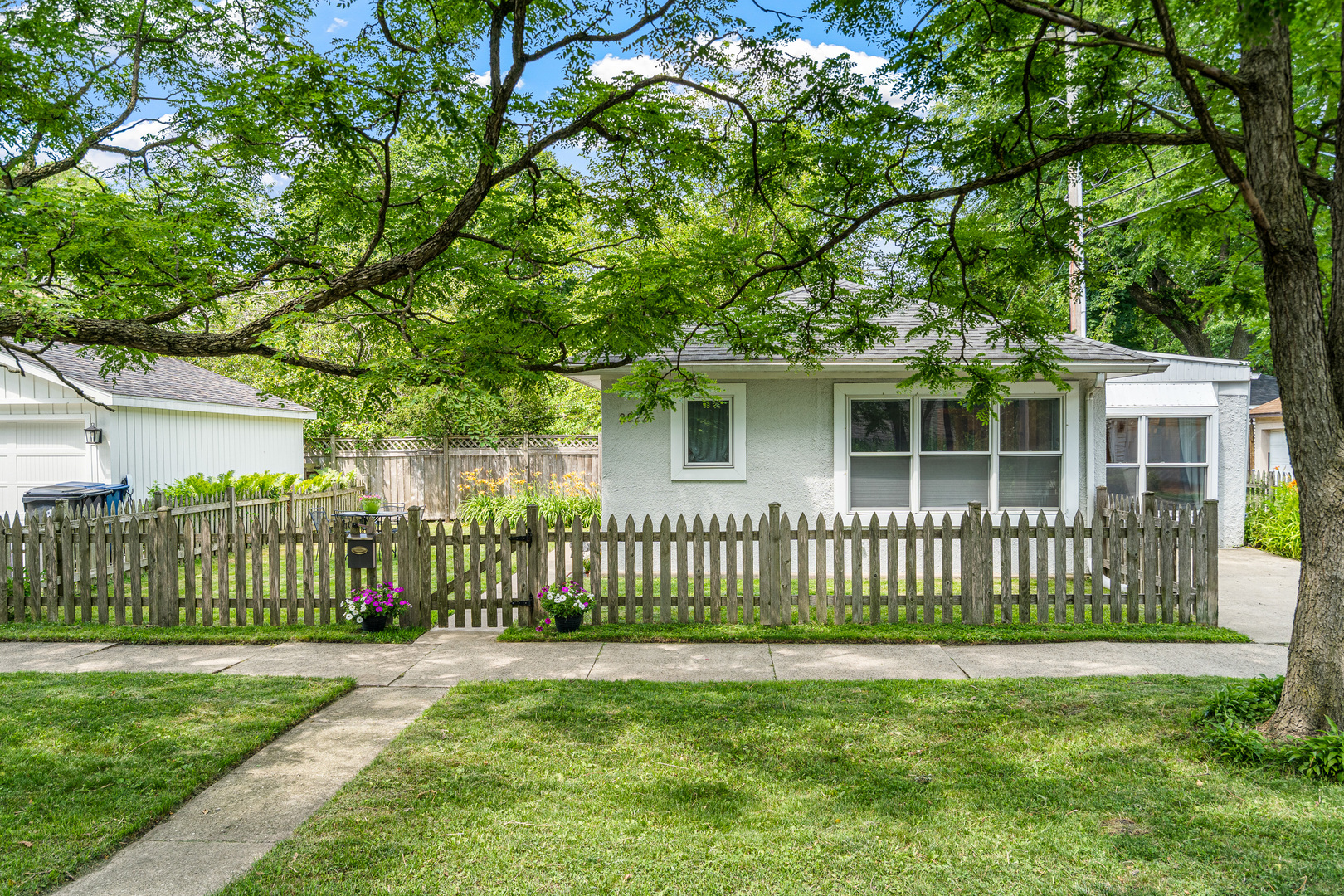 Beautiful updated home on treelined street in sought after northwest Evanston. This lovely, light filled home is walkable to the shops and restaurants on Central Street, the Central Street Metra station, many parks, gardens and nature sanctuaries, Northwestern University and much more!   The home features a wonderful layout, great natural light, hardwood floors, stainless steel appliances, granite counter tops, Jacuzzi tub and Grohe shower faucets in owner's suite bathroom, large customized closet in primary bedroom, large double closets in second bedroom, walk-in shower in second bathroom, brand new 40 gallon water heater and no stairs! Yard features a small fenced yard perfect for pet owners, lush soil great for gardening. This home is extremely well-maintained and loved.