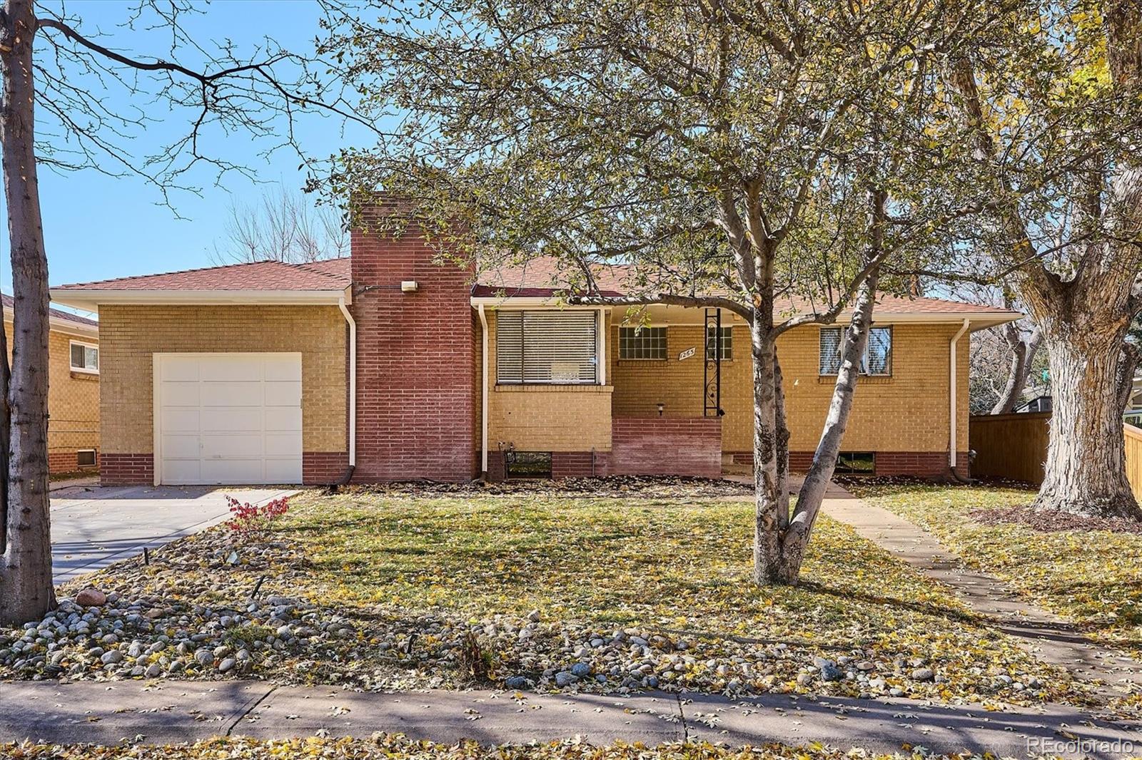 Completely remodeled rare mid-century brick ranch. Open floor plan, high ceilings, light and bright throughout. Original refinished hardwood floors throughout the main level. New interior and extertior paint. Updated lighting, plumbing and hardware fixtures througout. Enter through the main front porch area to the large living room with new can lighting, coved ceilings & highlighted by a floor to ceiling brick fireplace. Well situated dining room with slider door access to the brand new oversized concrete covered patio perfect for year round outdoor entertainment. Brand new kitchen with new soft closing cabinets and pantry, slab quartz countertops, SS appliances (gas stove) & new flooring.  Two good sized secondary bedrooms, updated full bathroom with new flooring, subway tiled bath/tub surround, glass block window, new vanity with quartz countertop and all new bath hardware. Linen closet with laundry chute! Large primary bedroom with remodeld 1/2 bath en-suite. Walk down the well positioned staircase into the basement with tall ceilings throughout & into a large great room/game room area with new LVP flooring and a floor to ceiling bricked fireplace. Opposite this room is another large great room with all new can lighting. Utility room with lots of storage space and a walk in laundry room that includes a storage closet, utility sink, washer & dryer. Updated bathroom with new vanity & fixtures, walk in shower with new floor & new tiled poured shower pan and shower surround wall tile. Large bedroom (window, but not eggress).  Attached garage. Solid systems including new boiler, radon mitigation system, good roof, solid electrical and plumbing. Professionally landscaped with front and back sprinklers/drip lines, fenced in yard, flagstone patio area, mature plants & trees, brand new concrete driveway, back patio and sidewalks. Close to everything including schools, parks, walking and biking trails, Cherry Creek, Downtown and major highways & throughfares plus much more