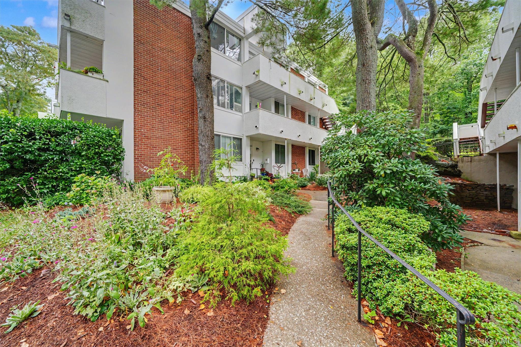 It’s not just a home, it’s a lifestyle! Impeccably maintained and completely move-in ready, this sun-filled corner-unit 3-bedroom, 2-bath condo at The Colony at Hartsdale features the rare bonus of two private balconies - one off the dining room and another off the primary bedroom suite. A generous open-concept living room/dining room provides terrific space for everyday living and entertaining, while the eat-in kitchen features a custom-built banquette with granite table and built-in storage. The spacious primary suite offers its own full bath and private balcony, while two additional generously sized bedrooms, a second full bath and in-unit laundry complete the living space. Recent improvements include fresh paint throughout, brand-new luxury vinyl flooring, brand-new recessed LED lighting, all new appliances within approximately the last 3-4 years, and a brand-new high-efficiency Carrier Infinity Series HVAC system with air handler providing 23 SEER efficiency. The unit also includes its own private locked storage room in the shared basement storage area. The Colony offers adult and kiddie pools, playground areas, guest parking and beautifully maintained grounds. Conveniently located with easy access to EVERYTHING - shopping, dining, major roadways, and Metro-North service from both Hartsdale and White Plains. Welcome home.
