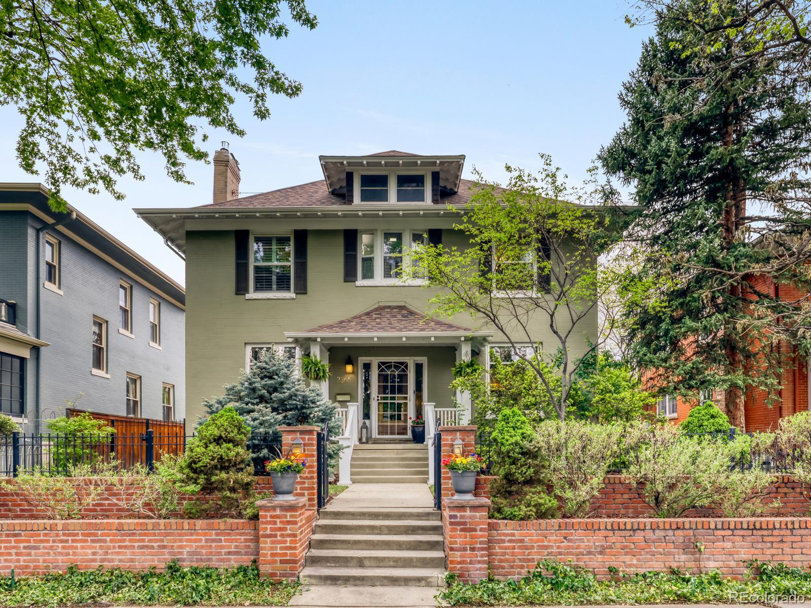 Welcome home to an exquisite Denver Square nestled on a beautiful tree-lined street in coveted Park Hill. From the grand entryway, meticulous attention to detail is evident throughout, with 10-foot ceilings, designer fixtures, gleaming hardwood floors, tall windows, and timeless period charm.The open dining room and chef’s kitchen blend modern elegance with everyday functionality, featuring quartz countertops, stainless steel appliances, open shelving, a stylish bar area, and seamless flow through double doors to the pristine outdoor living space and manicured yard — perfect for entertaining.Upstairs, you’ll find three generous bedrooms and two bathrooms, including a private primary retreat with a marble-appointed five-piece bath, deep soaking tub, spacious walk-in closet with built-ins, and a private deck showcasing stunning Denver skyline and mountain views.The finished basement offers a large guest suite or flexible living space, a designer bathroom. Additional highlights include fully paid-off solar and a tankless water heater for added efficiency and comfort.With classic architecture, refined updates, and exceptional indoor-outdoor living, this Park Hill home is truly a masterpiece.