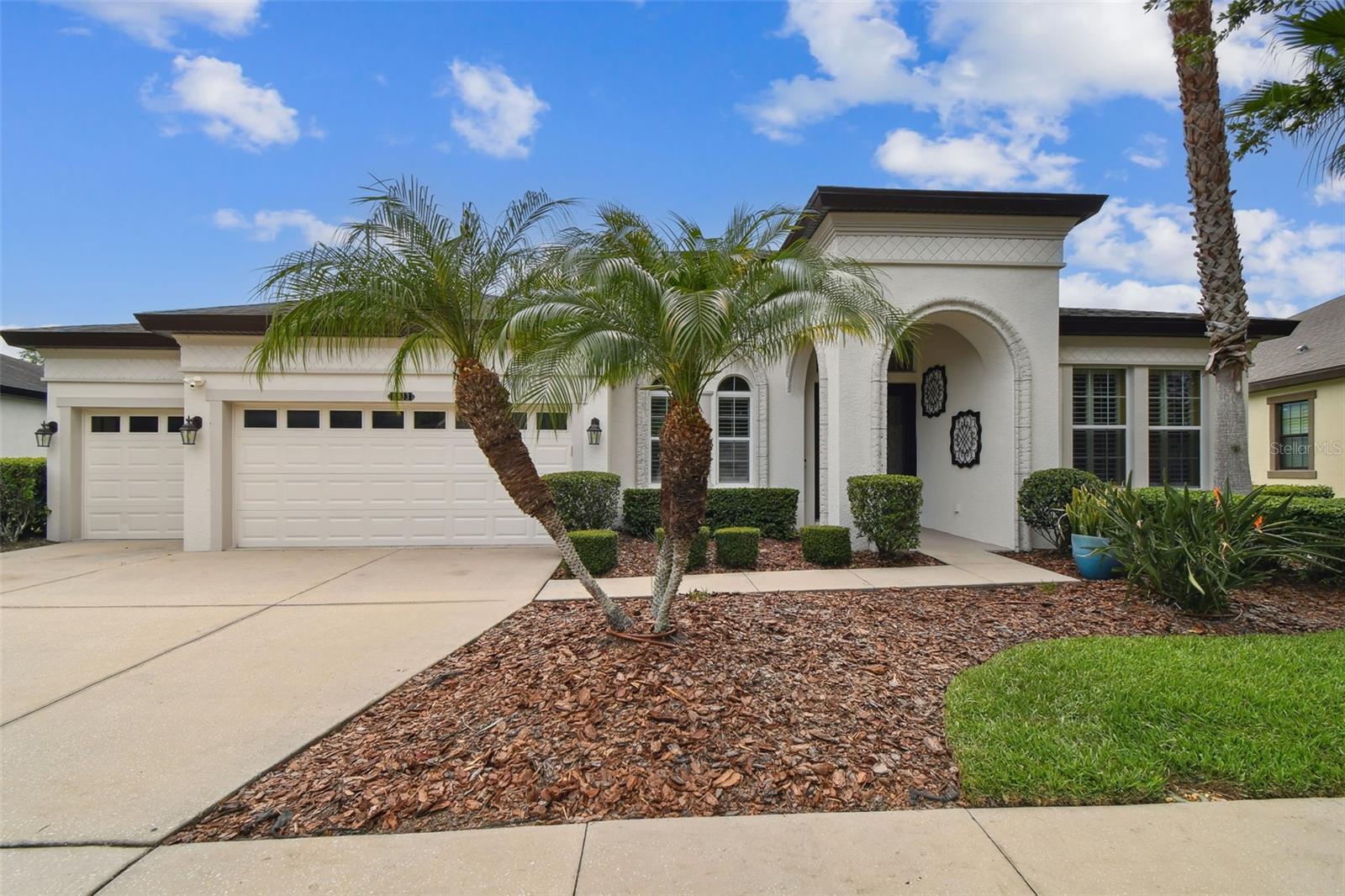 WELCOME to exceptional living in the highly sought-after Connerton development! This stunning Westbay Key Largo 3,179 sqft floor plan boasts 4 bedrooms, 3 full bathrooms, Office and a Bonus room, offering an ideal space for families and those who love to entertain.

From the moment you arrive, you'll be captivated by the home's impressive curb appeal, featuring a covered entryway and elegant double ornate glass doors that hint at the beauty within. Step into the inviting foyer and living/dining rooms to be greeted by soaring high ceilings and neutral tones, creating an airy, light, and bright atmosphere throughout. As you explore the spacious main living areas, you'll notice the numerous thoughtful upgrades that elevate this home to a new level of sophistication.

The kitchen is a true centerpiece, showcasing tall cabinetry, 5 burner gas stovetop, stone countertops, and a large island perfect for entertaining. Its central location offers picturesque views of the outdoor pool and landscape areas. Elegant lighting fixtures in the foyer, kitchen, and dining area add a touch of modern sophistication. The great room provides an ideal setting for hosting family gatherings and seamlessly transitions to the spectacular outdoor living area through a wall of sliding glass doors that fully retract.

The expansive screened lanai is designed for ultimate relaxation and entertainment, complete with beautiful brick pavers and a stunning fountain pool, offering ample space for outdoor activities. Backyard is all fenced. The primary bedroom, overlooking the pool, features a floor-to-ceiling custom mirror, two walk-in closets, a luxurious walk-in shower, a garden tub, stone countertops with dual sinks, and a linen closet.

This thoughtfully designed split-bedroom floor plan offers privacy with two guest bedrooms and a bathroom located at the front of the home, and a third bedroom with an additional guest bathroom towards the rear. The bonus room, also situated towards the rear with separate outdoor access, creates a private living space with wonderful views of the backyard and pool.

Living in Connerton means enjoying resort-style amenities, including two pools with an exciting water slide, a state-of-the-art fitness center, tennis and pickleball courts, a basketball court, a volleyball net, and much more. Beyond the luxurious features of this home, you'll also appreciate its convenient location within the desirable Land O' Lakes school district. While Tampa International Airport, shopping, and restaurants are not immediately adjacent, they are within a reasonable driving distance, providing easy access to everything you may need.

This home offers the perfect combination of luxury, space, and functionality, providing a comfortable and sophisticated lifestyle. Don't miss the opportunity to make this your future home!