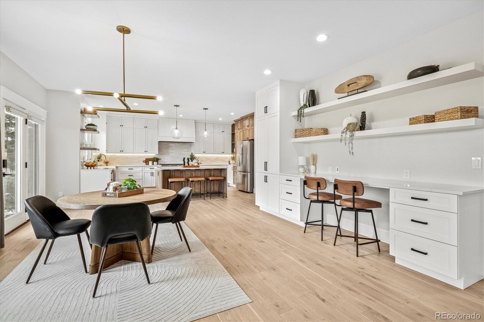 Designer Renovation in Pradera with Detached Office & Rooftop Deck!  Step into this fully remodeled showpiece in Parker’s coveted Pradera neighborhood—where luxury design meets livable function. From the elegant circular drive and string-lit courtyard to a private detached office, this home is truly one-of-a-kind. Inside, enjoy stunning white oak floors, on-trend fixtures, quartz countertops, a chef’s kitchen with a six-burner range, and an airy great room with a shiplap fireplace wall. The main floor features a guest suite and magazine-worthy mudroom with full fridge, cubbies, and dog wash. Upstairs, the primary suite showcases sweeping views, a luxe bath, and direct access to the unforgettable rooftop deck. Three additional bedrooms, a cozy loft lounge, and two more bathrooms complete the upper level.  Outside, relax on the split-level patio with firepit surrounded by mature landscaping and gardens.  Located near Pradera’s private golf club, pool, tennis, and trails. Rare chance to own a masterfully reimagined home at this price, entertain in style with a full kitchen bar, rec space, study nook, exercise area, and hidden speakeasy-style tasting room. Outside, relax on the split-level patio with firepit surrounded by mature landscaping and gardens.