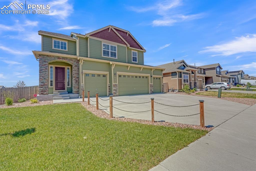 Beautiful and spacious 2-story home with walk-out basement offering over 3,400 sq ft of thoughtfully designed living space, perfectly suited for multigenerational living! 4 car-garage - over 850 sqft. Built in 2019 and sitting on a generous corner lot (nearly a quarter acre), this home blends modern finishes with flexible functionality. The main level features an open-concept layout with luxury vinyl plank flooring and seamless flow from the kitchen and dining area to a large upper deck—ideal for entertaining or relaxing.

The finished walk-out basement is a standout space, ideal for guests or extended family, complete with a private entrance feel. It features a fully equipped kitchenette with quartz countertops, refrigerator, microwave, dishwasher, and disposal. The basement also includes LVP flooring throughout, a 3/4 bathroom with stunning tile work, quartz vanity, and walk-in shower with a barn door, a spacious bedroom with its own Mitsubishi electric A/C unit, separate living area with a second Mitsubishi unit, and a private laundry room with built-in cabinetry.

Upstairs you’ll find four well-sized bedrooms, including a luxurious primary suite with tray ceilings, a spa-like bath featuring a soaking tub, double vanity, and large walk-in closet. Large upper full bathroom w/ double vanity. A versatile loft adds extra flex space, and the upper-level laundry room includes tile flooring and a window for natural light.

The backyard is an entertainer’s dream, boasting a covered lower-level concrete patio with a hot tub, concrete pathway around to the front yard, a double-wide side entry gate, and a 12x8 storage shed. 

Additional features include cozy fireplace, a safe built into the primary bathroom, central A/C, radon mitigation system, and no HOA (home is located within a metro district).