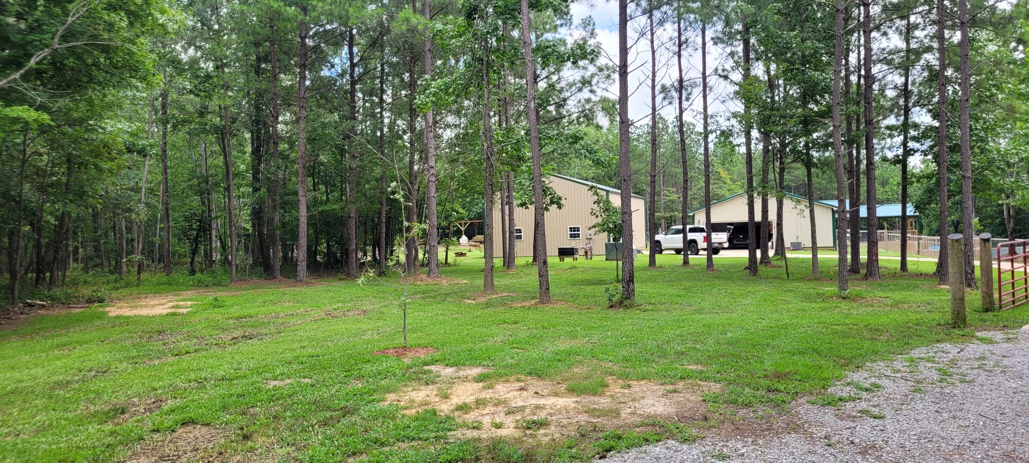 Escape to peaceful country living with this beautiful 2 bedroom, 2 bathroom barndominium nestled on 36 acres. Designed with an open concept floor plan, this home features vaulted ceilings, granite countertops, quality cabinetry, and two spacious primary suites, making it ideal for family, guests, or multi generational living. A dedicated office could easily serve as a third bedroom.Step outside and enjoy everything this unique property has to offer. Wander the wooded trails, relax by two stocked ponds, or cool off in the charming old fashioned homemade dipping pool. Garden enthusiasts will appreciate the established garden area, and there is also some fenced area  for animals or hobby farming.The 30x50 impressive workshop and garage features 10 Ft  doors and abundant space for equipment, vehicles, boats, recreational toys or hobbies. In addition workshop is also plumbed for a bath, washer and dryer.  A sawmill on the property adds even more versatility, and some equipment and tools are  available for purchase.Additional highlights include a concrete driveway, a welcoming covered front porch, and the privacy and tranquility you’ve been searching for. Whether you’re looking for a full time residence, hobby farm, or private retreat, this one of a kind property offers endless possibilities.