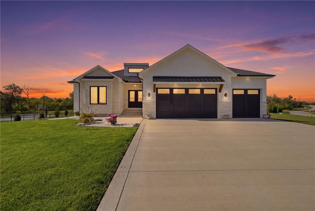 Stunning Lake Winnebago beauty...just like new...save $150K vs. reproduction and ready for delivery! Soaring ceilings and plenty of light as you enter, the Foyer opens up beautifully into a spacious Great Room with fireplace, floating shelves, tinted windows, custom shades and contemporary lighting. This kitchen is the heart of the home showcasing newer 2024 appliances, quartz countertops, walk-in pantry and elegant dining area with gleaming hardwood floors and stylish tray ceiling. The Primary Suite is massive in size and features shiplap ceiling, custom blinds and a large walk-in closet with pull-downs. The spa inspired bath offers double vanities, whirlpool tub & beautifully tiled walk-in shower. Adjoining laundry room off of Primary Bedroom blends function with sink and granite tops. Two spacious main floor bedrooms share a stylish bathroom featuring vinyl plank floors and a tiled shower. This 3 bedroom main floor layout offers ton's of possibilities! Gorgeous curved staircase leads to a large Rec. Room featuring LVP floors, floating shelves, granite tops and a 4th bedroom with oversized egress windows allowing in abundant light. Widened doorways and ADA-compliant toilets provide ideal accessibility throughout and dual zoned HVAC offers comfort and efficiency.Enjoy outdoor living on the covered Trex deck overlooking spacious corner lot and backing to peaceful greenspace. Enjoy Lake Winnebago premier amenities including: Boating, trails, pickleball courts, equestrian facilities, play area and a stunning new pool/clubhouse. See listing agent for annual boat slip rental information, enjoy lake access and all the perks that come with it!